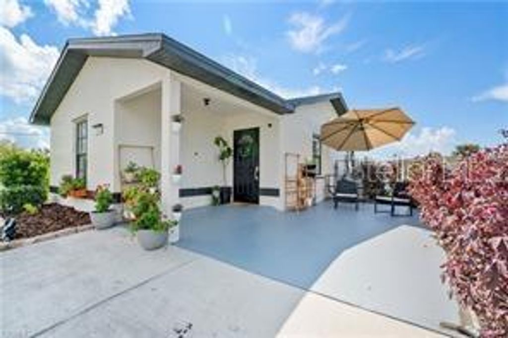 Photo of 126 Palmetto Circle NE, Port Charlotte, FL 33952 (MLS # C7515412)