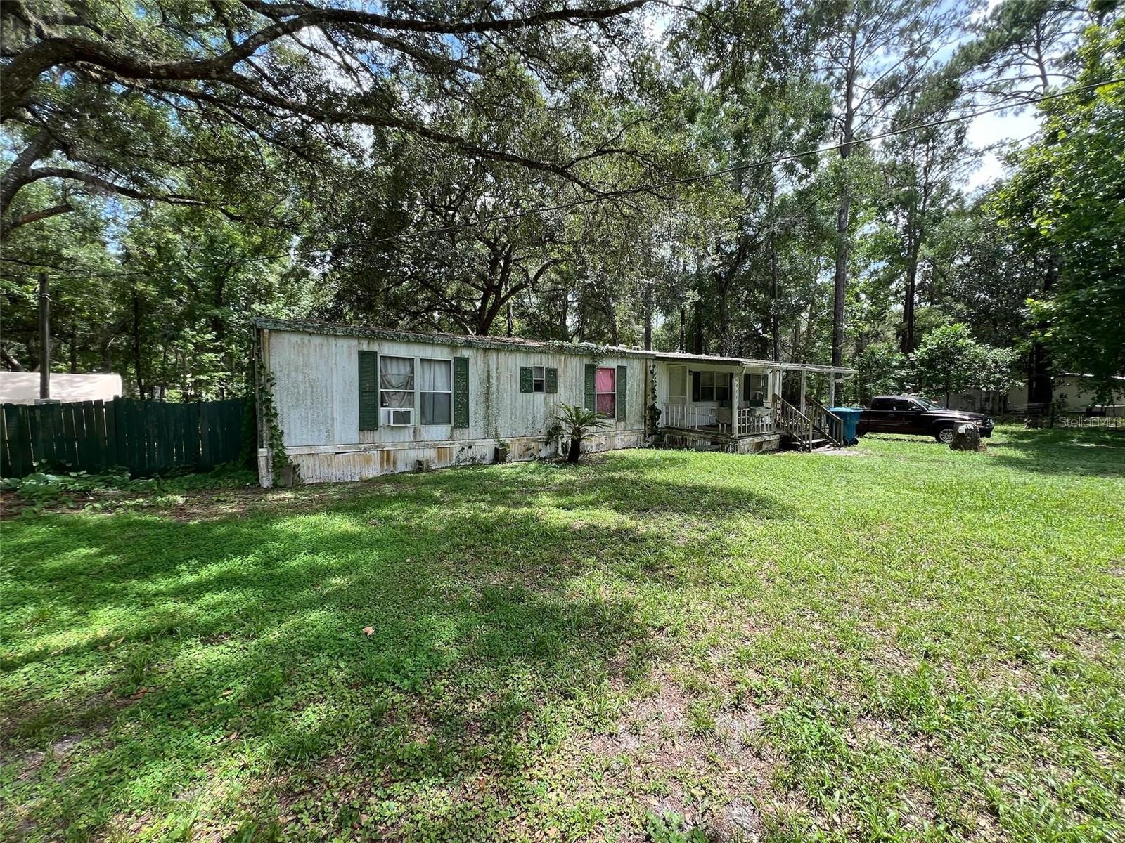 Looking for a project with big potential? This 3-bed, 2-bath mobile home on almost a full acre offers country living just minutes from town. Large yard, no HOA, and plenty of space for toys, pets, or a garden. Sold AS-IS—bring your tools and imagination!