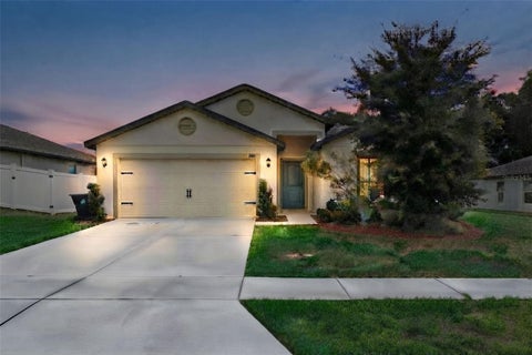 Photo of 1694 Hideaway Flat Street, Mascotte, FL 34753 (MLS # O6445589)