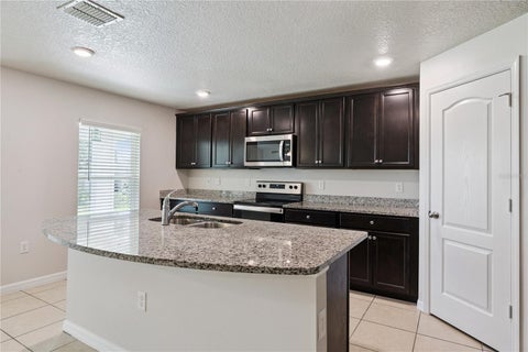 Tiny photo for 1694 Hideaway Flat Street, Mascotte, FL 34753 (MLS # O6445589)