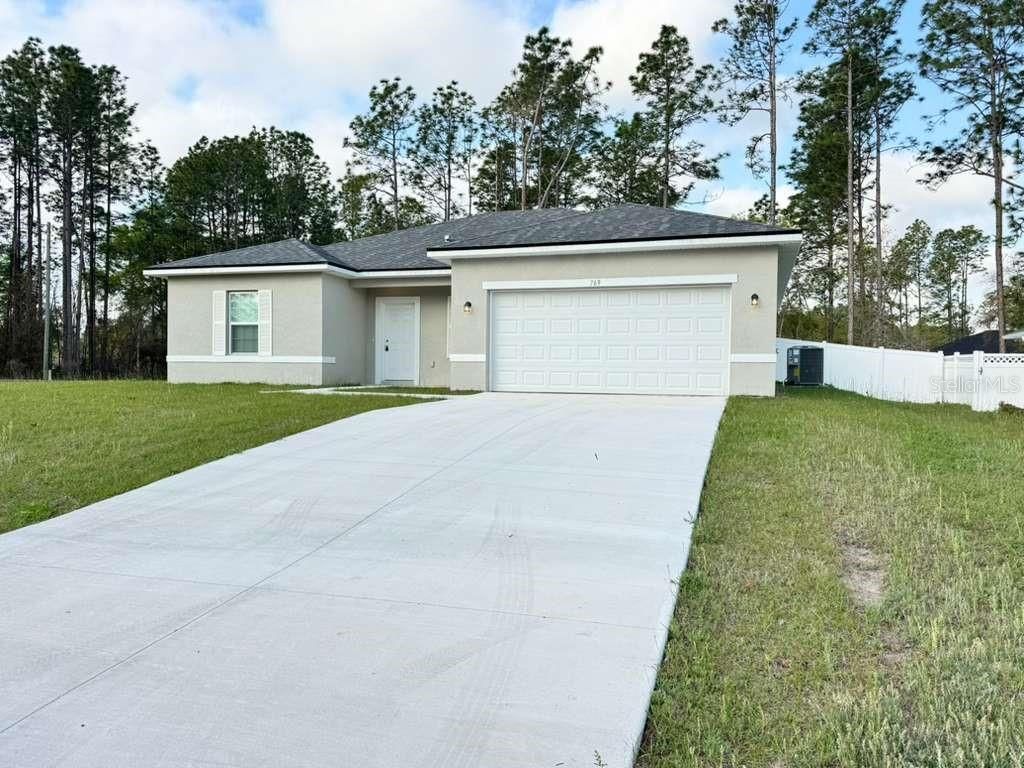 Photo of 769 Marion Oaks Pass, Ocala, FL 34473 (MLS # OM721325)
