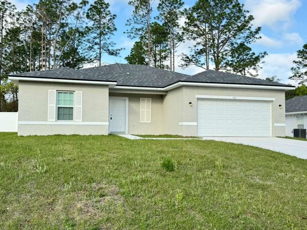 Photo of 769 Marion Oaks Pass, Ocala, FL 34473 (MLS # OM721325)