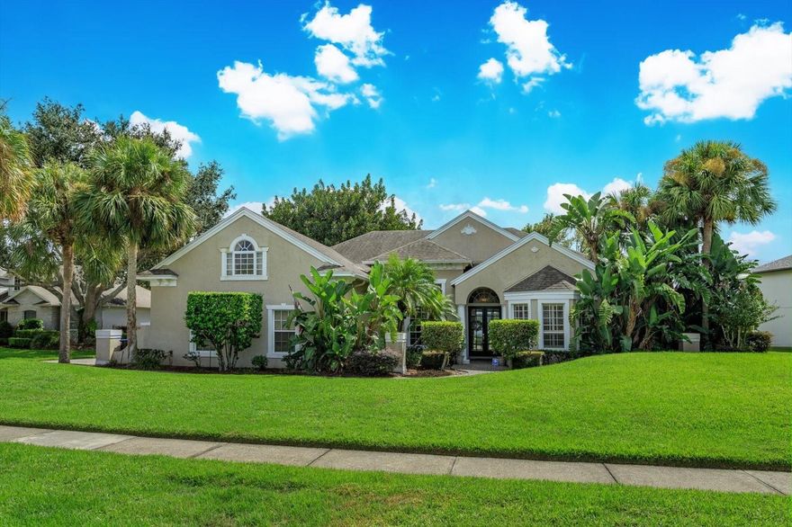 Stunning custom lakefront home with 3 bedrooms, 3 baths, den or office, formal living and dining room, and a screened-in pool overlooking nightly Disney fireworks! This split-bedroom plan offers privacy and elegance, featuring ceramic tile throughout, granite countertops, stainless steel appliances, 42” cabinets with crown molding, and a gas fireplace. The spacious primary suite includes a custom closet, split vanities, and a walk-in shower. The bonus room features its own A/C unit and controls, and is pre-plumbed and A/C-ready for an additional bathroom and closet. Enjoy the convenience of an inside laundry room and 3-car garage. Step outside to your private dock on a 38-acre private ski lake and relax in your backyard oasis while taking in serene lake views. This home is the perfect blend of luxury, comfort, and Florida living in Winter Garden. Close proximity to shopping, new hospital, and major attractions.