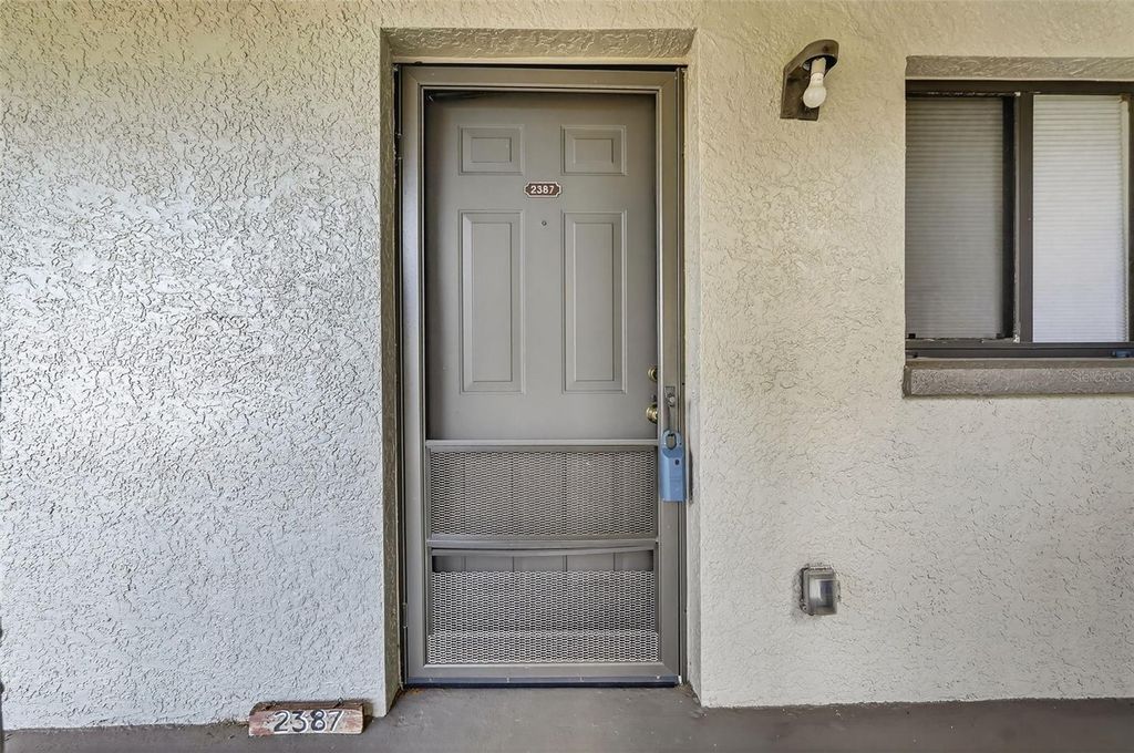 Photo of 2387 Lake Heather Heights Court #203, Dunedin, FL 34698 (MLS # TB8430648)