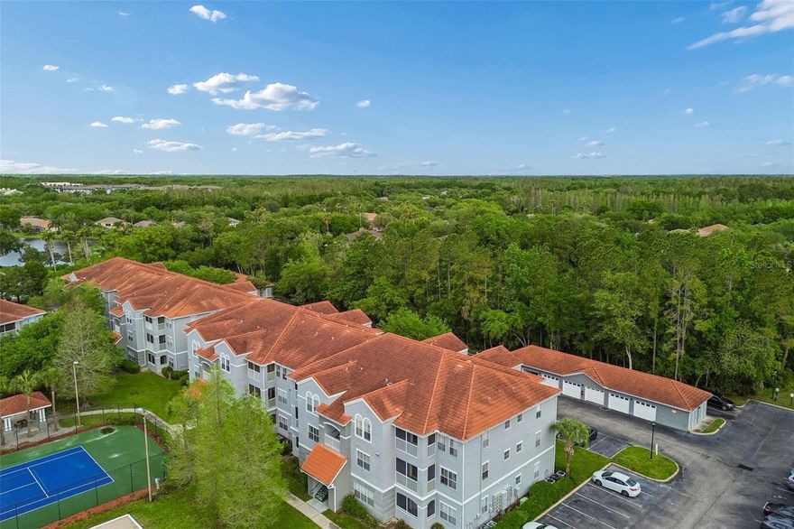 Modern corner-unit condo offering low-maintenance living in the gated Enclave at Richmond Place. This third-floor residence features a 2-bedroom, 2-bathroom split floor plan, highlighted by a beautifully renovated primary bathroom. A newer HVAC and water heater provide peace of mind. The open-concept living and dining area is flooded with natural light, leading to a private screened-in balcony with a dedicated storage closet.  Located in the heart of New Tampa, you are minutes from The Shops at Wiregrass and Tampa Premium Outlets. This prime location offers a short commute to the University of South Florida (USF), Downtown Tampa, and Tampa International Airport. The Enclave at Richmond Place provides resort-style amenities including a large swimming pool, tennis courts, beach volleyball, a playground, and a luxury clubhouse. With low HOA fees and modern interior upgrades, this home is move-in ready. View the virtual tour and schedule your private showing today.