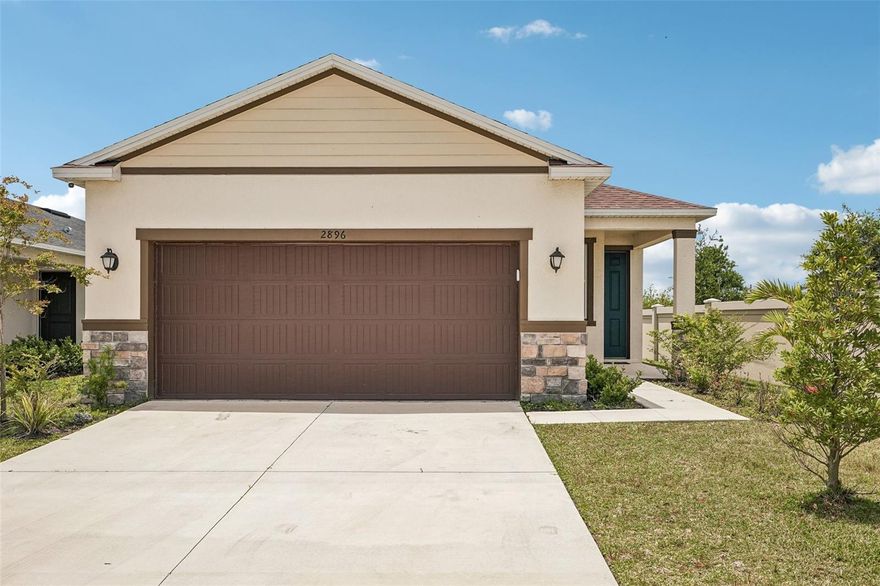 PERFECT OPPORTUNITY. BARELY LIVED IN. LOOKS BRAND NEW. WON"T LAST AT THIS PRICE. Located in the sought-after community of Heron Bay, this beautifully designed 2024-built corner-lot residence offers modern comfort, style, and convenience in a move-in ready setting. Easily Access from I-75 in an area that is still growing. Very close to the Skyway for boating and fishing. A welcoming front porch sets the tone for the home’s inviting open-concept layout, thoughtfully designed for both everyday living and entertaining. Designated office space at the front of the house. The kitchen features a spacious center island with breakfast bar seating, stainless steel appliances, and a walk-in pantry, seamlessly connecting to the main living and dining areas. Every room has perfect storage. Luxury vinyl plank flooring extends throughout the main living spaces, while the bedrooms have the comfort of carpeting. The primary suite includes a well-appointed ensuite bath with dual sinks and a walk-in glass shower. Additional highlights include a full-size washer and dryer in the dedicated laundry room, impact windows and doors, a covered rear patio, fenced backyard that includes great side yard for either a dog run or a place to practice soccer and an attached large two-car garage. Ideally situated for easy access in and out of the community, the home is also conveniently close to Heron Bay’s exceptional community amenities. Community pool and mail area right across the street. ROOF, A/C, HOT WATER HEATER, AND ELECTRIC ONLY 2 YEARS OLD!!!!!!!!!           This is an affordable neighborhood, a starter home, or a perfect second home for winter residents.