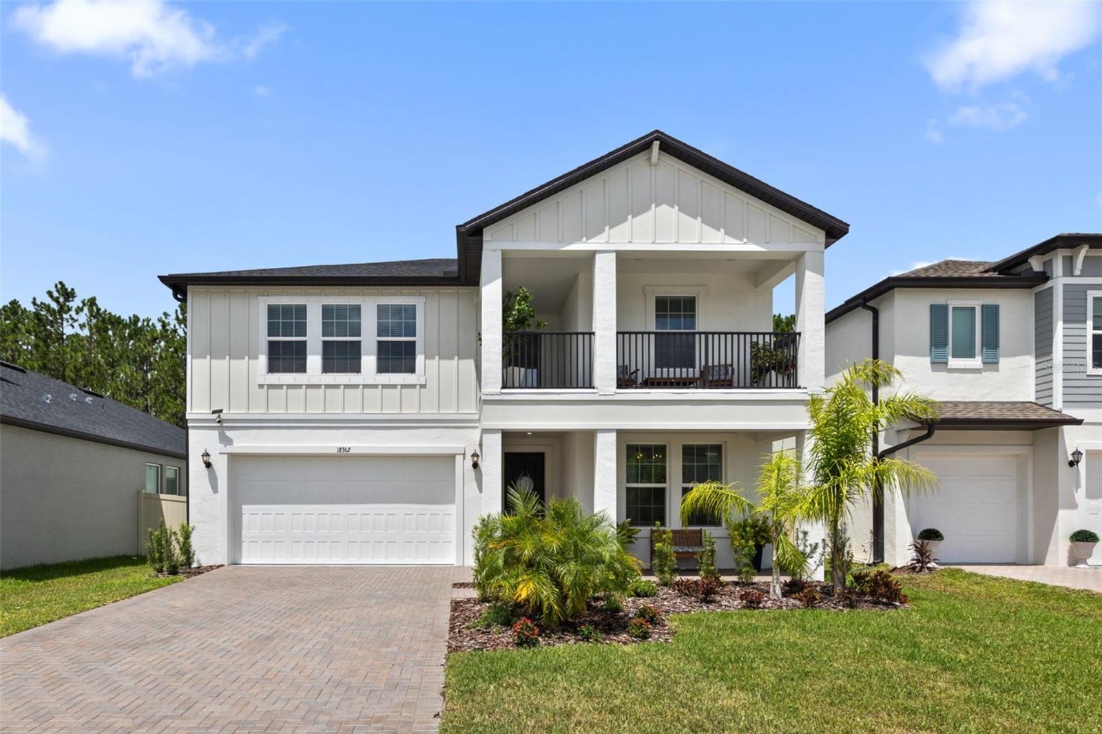 Why wait to build when your dream home—with a pool already in place—is ready now?! This stunning Preston model in Pearl Estates is move-in ready and loaded with high-end upgrades inside and out. Set on a premium wooded lot, this 5-bedroom, 4.5-bath home offers an ideal layout with 3,334 square feet of thoughtfully designed living space perfect for entertaining, relaxing, and enjoying the Florida lifestyle. The versatile layout includes a spacious open living area, a first-floor primary suite with expansive en-suite bath and walk-in closet, an additional first-floor suite with en-suite bath and walk-in closet with custom built-ins, an oversized loft with wet bar and beverage fridge, plus a charming balcony. The newly added private heated saltwater pool with sun shelf, travertine decking, fully fenced yard, and mature landscaping creates a luxurious outdoor retreat, a rare find for any new construction home. Inside, the designer kitchen shines with a custom range hood, ceiling-to-counter backsplash, expansive island with breakfast bar, stainless steel GE appliances, butler’s pantry, and an impressive walk-in pantry. Additional upgrades include a custom floor-to-ceiling fireplace, designer lighting, custom window treatments, fresh designer paint, and an upgraded washer and dryer in the dedicated laundry room all thoughtfully selected to elevate the home’s style and function. The drop zone and attached 2-car garage add even more functionality and ease. Zoned for top-rated Steinbrenner High School, with no CDD fees, low HOA, and a convenient location just minutes from everything Tampa has to offer. This is new construction reimagined - fully finished, thoughtfully upgraded, and ready to welcome you home!