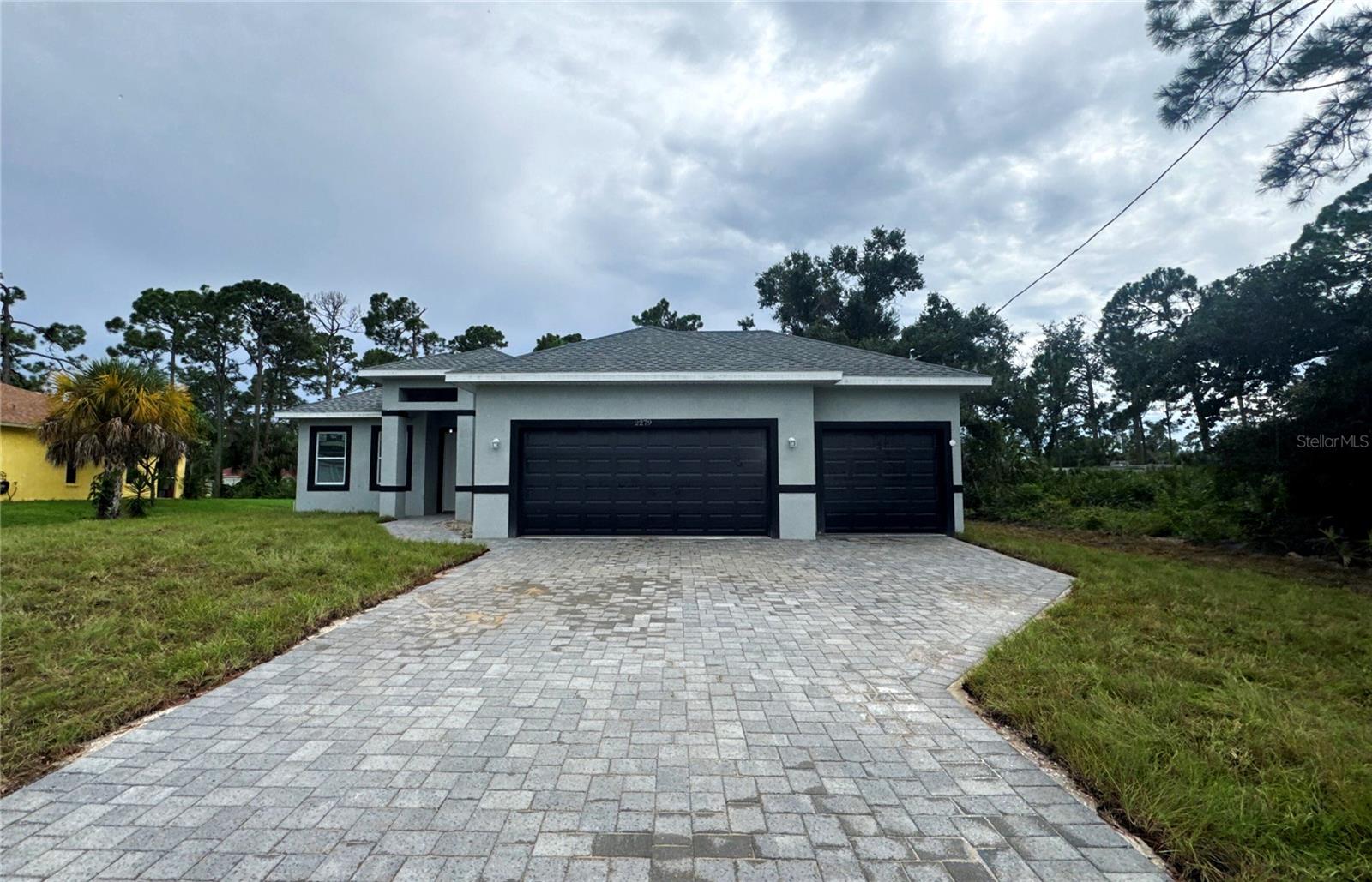Under Construction. Beautifully designed home with 1,839 sq ft of living space, featuring 3 spacious bedrooms, 2.5 bathrooms, and a 3-car garage. This open-concept layout connects the kitchen and living areas, making it ideal for family gatherings and entertaining. The kitchen is equipped with high-quality appliances and a central island for easy meal prep. A spacious garage comfortably accommodates three vehicles, with additional storage space. With a total area of 2,866 sq ft, including an inviting 82 sq ft entry, a 655 sq ft garage, and a relaxing 290 sq ft lanai, this home offers both functionality and comfort to meet all your lifestyle needs. Additional features include a SMART KEY system for enhanced security and the peace of mind that comes with a 2-10 HOME BUYERS WARRANTY. Don’t miss out—schedule a showing today!