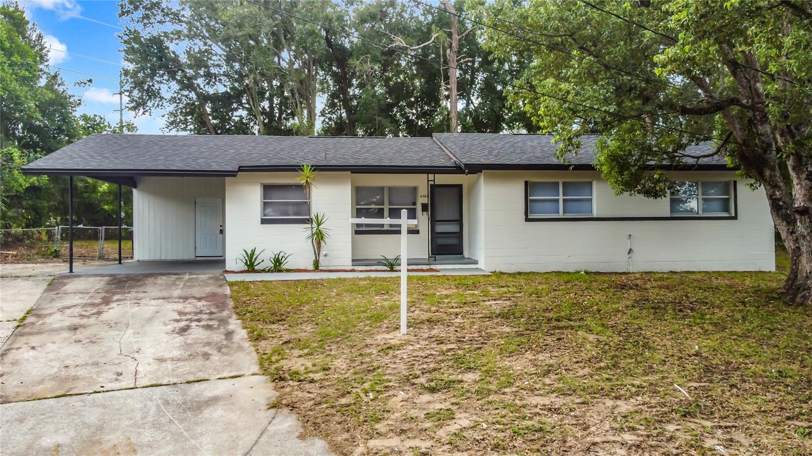 This stunning 4-bedroom, 2-bathroom block home has been completely updated. Enjoy peace of mind with a brand-new architectural roof, plus beautifully remodeled bathrooms, new floors with stylish baseboards, updated light fixtures, and a fresh coat of paint inside and out. The Chef’s kitchen features a brand-new cabinets, a large island, and stainless-steel appliances perfect for cooking and entertaining. This home offers a spacious, open layout filled with natural light. Step outside to a huge, private backyard, backing up to a scenic walk and bike trail. Plenty of room for outdoor living, gardening, or future additions. Move-in ready, with no HOA restrictions, simply enjoy the freedom.