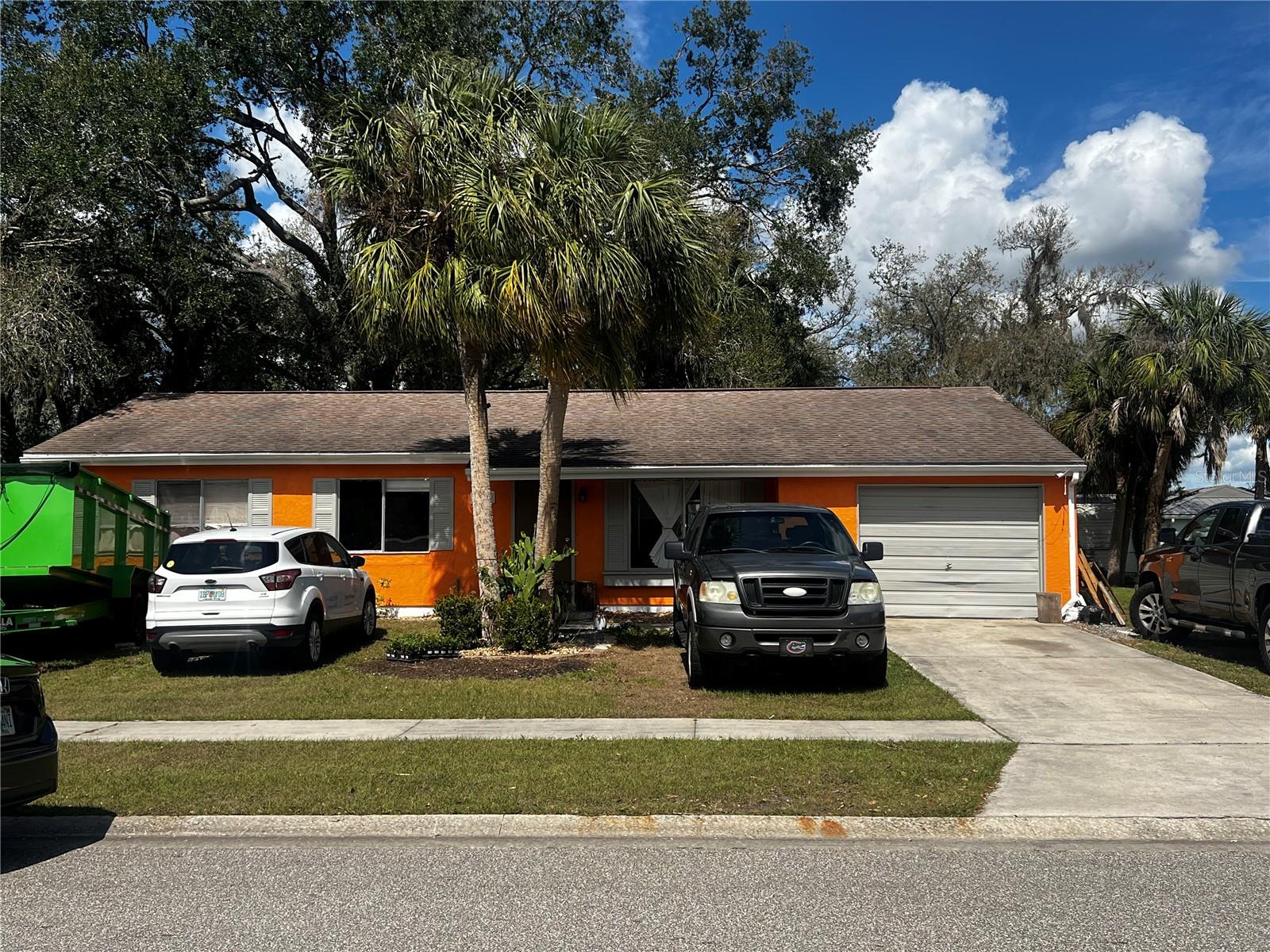 Welcome to this charming home, ideally situated in a no-HOA, no-CDD neighborhood and outside of the flood zone. The screened-in porch provides a tranquil outdoor retreat, perfect for relaxing and enjoying the breeze. Inside, a flexible bonus room awaits, offering endless possibilities—whether as an additional bedroom, a cozy den, or a home office. Surrounded by mature trees, this home offers both privacy and serenity while being conveniently located near shopping, dining, and local amenities. With a 2015 roof and an unbeatable location, this inviting home is not to be missed!.