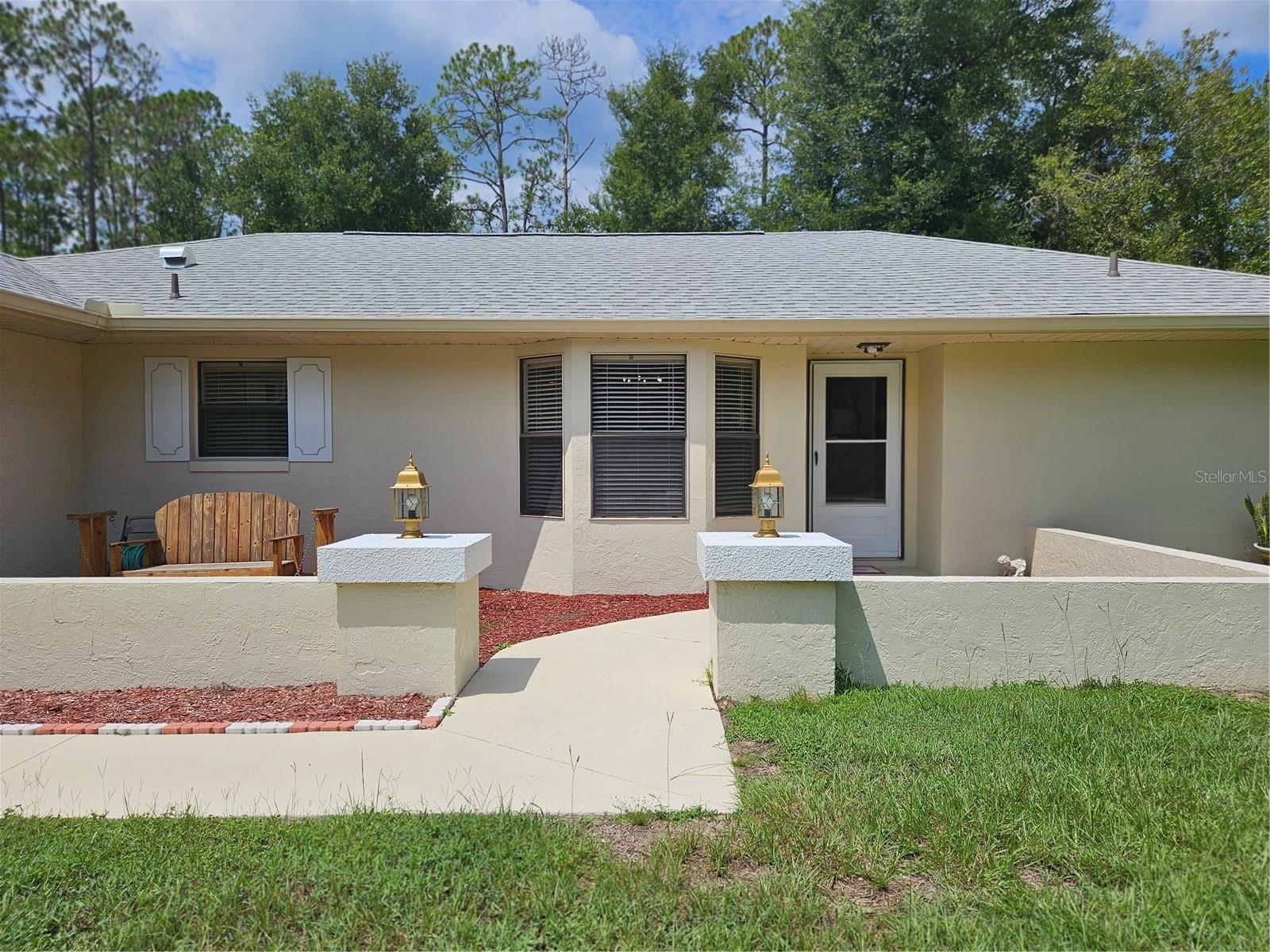 Welcome to Rainbow Springs! This charming 2-bedroom, 2-bath home offers the perfect blend of comfort, functionality, and access to one of Florida’s most sought-after natural treasures—the Rainbow River. Set on a spacious 1.02-acre lot, this residence features a thoughtfully designed split floor plan, highlighted by a bright and inviting living area. The home includes a Florida room, perfect for relaxing year-round, and two versatile sheds (8x10 and 8x12) that provide ample storage or workshop space. Inside, you’ll find a well-equipped kitchen with a breakfast bar, stone counters, and wood cabinetry, complemented by an open dining area. The master suite boasts a walk-in closet and private bath, while the guest bedroom is generously sized with easy access to the second full bath. Additional features include tile and laminate flooring throughout, central heating and cooling, ceiling fans, and a spacious 2-car garage. Beyond the home, residents of Rainbow Springs enjoy a wealth of community amenities: Community center and club house, Swimming pool, tennis courts, and shuffleboard and exclusive access to the private residents-only beach on the Rainbow River with picnic pavilion, kayak launch, swimming area, and restroom facilities. With its prime location near outdoor recreation, golf, shopping, and dining, this home offers the best of Florida living—whether you’re seeking tranquility or an active lifestyle. Schedule your private showing today!