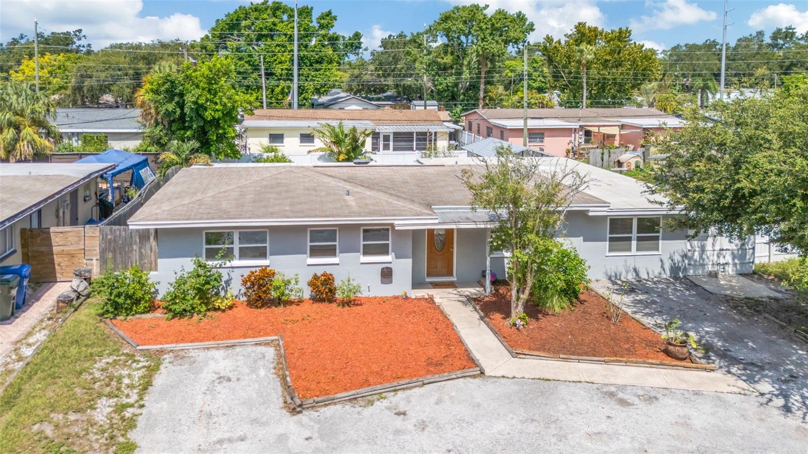 Prepare to be impressed as you step into this updated 4-bedroom, 2-bath gem! There is even an additional bonus for a home office or recreation room. The layout is so versatile. Be sure to see the attached floor plan and explore the options. The back yard will not disappoint! Enjoy the refreshing pool, the built in grill and the covered porch for endless family fun and gatherings. And the yard is fully fenced offering extra privacy. Need an outdoor workshop? No problem! The large metal carport in the back yard is accessible by a long paved path on the side of the home, and is the perfect spot to restore that old car, park your ATV, or serve as a shelter for your gardening projects. And the indoor utility offers space for storage and a laundry room. Parking is no issue with 2 spaces as well as a circular driveway. The windows have been replaced and the kitchen and bathrooms have been updated. Recent improvements include the roof, flooring and paint. Plus a new refrigerator was just installed. Schedule your showing today!