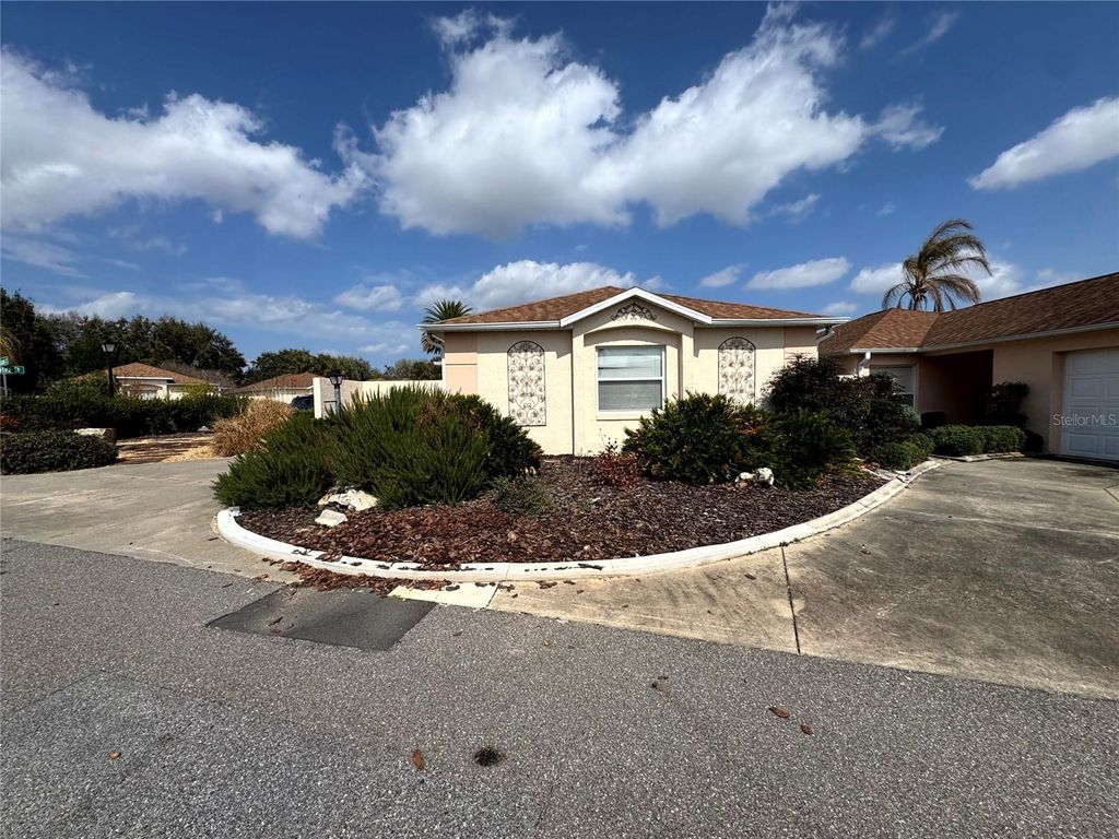 Photo of 413 Calzada Court, Lady Lake, FL 32159 (MLS # O6386064)