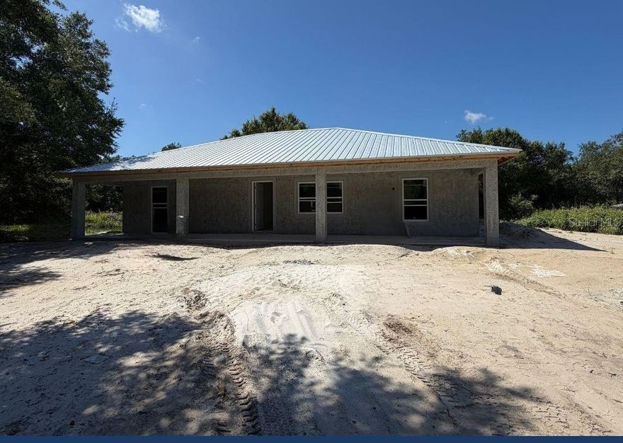 Under Construction. Under Construction. HOME CURRENTLY UNDER CONSTRUCTION. Welcome to your dream home in the serene community of Peace River Acres in Arcadia! This brand-new, open concept residence is perfectly situated for those seeking a blend of tranquility and convenience. Boasting a prime location, this home is just a stone’s throw away from the majestic Peace River, offering easy Gulf access for boating enthusiasts. Additionally, its proximity to Port Charlotte provides a perfect balance of peaceful living and easy access to urban amenities. Step inside to discover a modern, airy space featuring three bedrooms and two bathrooms. The heart of this home is its stunning kitchen, equipped with sleek granite countertops and top-of-the-line stainless steel appliances, ideal for both casual family meals and entertaining guests. The house also features an oversized laundry room, adding to the practicality and functionality of the space. Throughout the home, you’ll find durable and stylish vinyl plank flooring, combining the beauty of hardwood with the resilience needed for a busy lifestyle. Additional reinforcements for hurricane building codes, including high impact, low-E windows and doors. Additional features will include a full detached garage/carport for parking. Experience the perfect blend of modern living and natural charm in this exquisite Arcadia home! Interior Photos from previous build some colors finished may differ. As construction progresses new pictures will be uploaded.