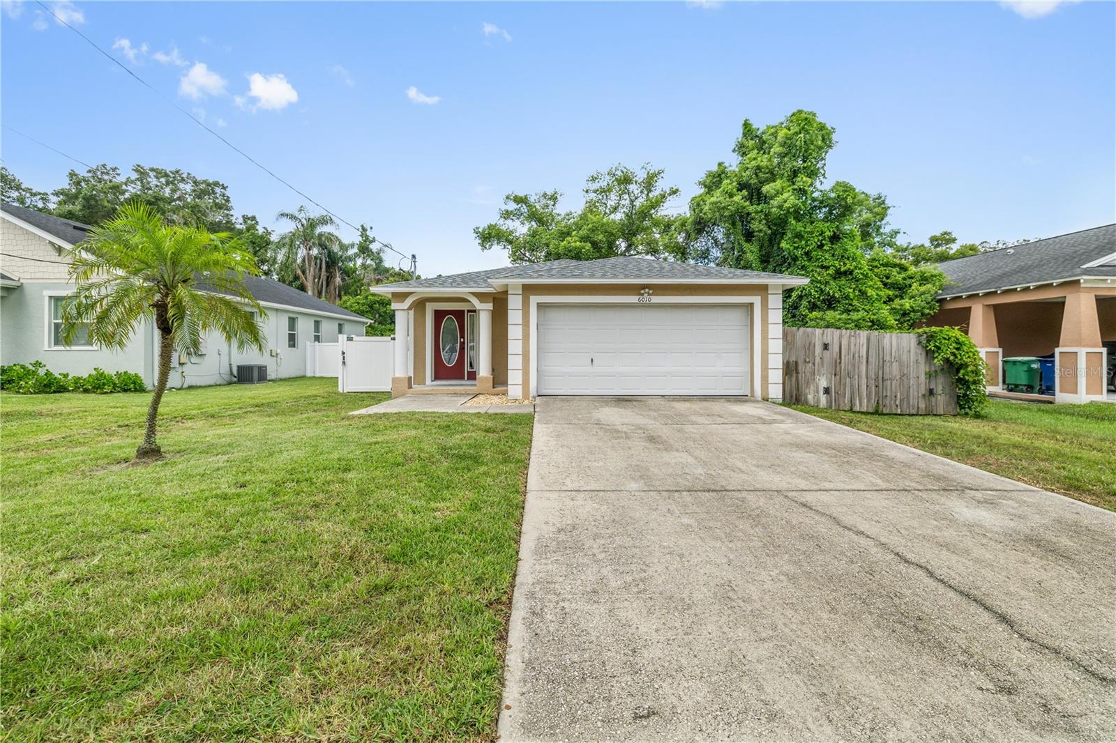 Step inside this charming and updated home in the heart of Seminole Heights that features an open-concept living space, wood-look ceramic flooring, and an updated kitchen with granite countertops and newer stainless steel appliances. Enjoy updates such as the brand-new roof, newer AC (2020), and a hurricane proof shed (2020). French doors off the main living space lead to a large, fully fenced backyard perfect for entertaining guests, pets, or outdoor hobbies. Off the main living area are the three bedrooms including a roomy primary suite with an ensuite bathroom. This home is complete with a spacious 2-car garage. Location of this home is incredible with just a short walk or minutes drive to Publix and many Seminole Heights’ fabulous dining spots as well as quick access to I-275 which puts you only minutes from downtown Tampa and provides easy access to anywhere in Tampa.