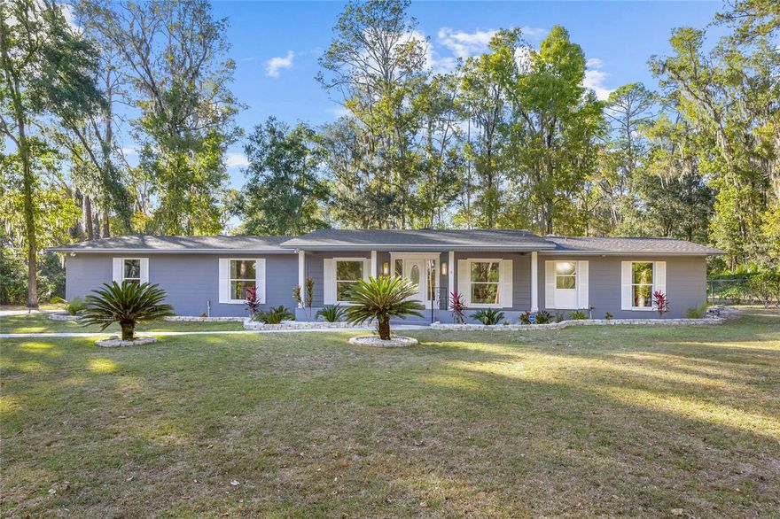 Welcome home to timeless style and a sparkling pool on 1.32 acres in the sought after West Hills neighborhood. Every inch of this dreamy Florida ranch has been thoughtfully renovated, blending luxury finishes with that easy Gainesville charm we all love. Located just a short walk to HCA North Florida and an easy drive to UF, I-75 and all that Gainesville has to offer, this home sits perfectly on a larger lot with mature trees and lush landscaping. Step inside and unwind in your own retreat featuring four bedrooms, two baths, and a sunny Florida room that opens to your newly refinished pool, ready for weekend dips and backyard gatherings. The kitchen is truly the heart of the home, inspired by Michelin level design and crafted with care. You’ll love the oversized island, premium stainless appliances, double convection oven with air fryer combo, pot filler, and custom floor to ceiling cabinetry. The kitchen flows seamlessly into a cozy family room with a wood burning fireplace and French doors that lead to the airy Florida room, an entertainer’s dream. Natural light pours through the new windows, highlighting the fresh finishes and modern touches throughout. The primary suite offers a spa like bathroom with dual sinks, quartz countertops, and double rain shower heads. The oversized two car garage includes a finished, air conditioned office or workshop, and the 12x18 wired shed out back adds even more space for projects or storage. Behind the scenes, the essentials are covered too with roof (2023), HVAC (2023), and water heater all recently updated. This is that Gainesville home with all the right details and heart, the one that just feels right when you walk in, don’t hesitate and miss your opportunity to call this one home.