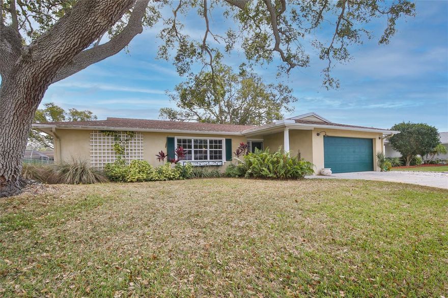 Under contract-accepting backup offers. Coming Soon:  NEW ROOF.   Overflowing with charm and custom finishes, this beautifully updated Gulf Gate home boasts all the features required for comfortable contemporary living. This sunlit getaway welcomes you with an extended driveway, trellis detailing, and glass door entry. The spacious interior spans nearly 2,200-square-feet and offers a reimagined open-concept layout adorned with exceptional upgrades throughout, including designer lighting, hardwood flooring, oversized windows, coffered ceilings, and storm shutters. Walls of tailored built-ins with natural wood accents add the right amount of character to the thoughtful, art-deco design. The living and dining room is steps from the unique, eat-in kitchen. This delectable space is filled with beams of natural light from the adjacent family room and features stainless-steel appliances (including gas Viking stove), farmhouse sink, concrete countertops, subway tile backsplash, modern cabinetry with glass cutouts, and dining nook with built-in bench seating. Three bedrooms are arranged in a split layout to optimize privacy. The primary bedroom is a secluded retreat with en-suite bathroom, walk-in closet. Two guest bedrooms and an office complete this exceptional residence. Resting on an oversized property of nearly a quarter-acre, offering plenty of room to add your own swimming pool and patio oasis. Gulf Gate is one of the most sought-after neighborhoods in South Sarasota because of its tempting location, in ideal proximity to shopping centers, myriad of wonderful eateries, as well as immaculate Gulf beach at the renowned Siesta Key, and the cultural lifestyle of downtown Sarasota just minutes away.