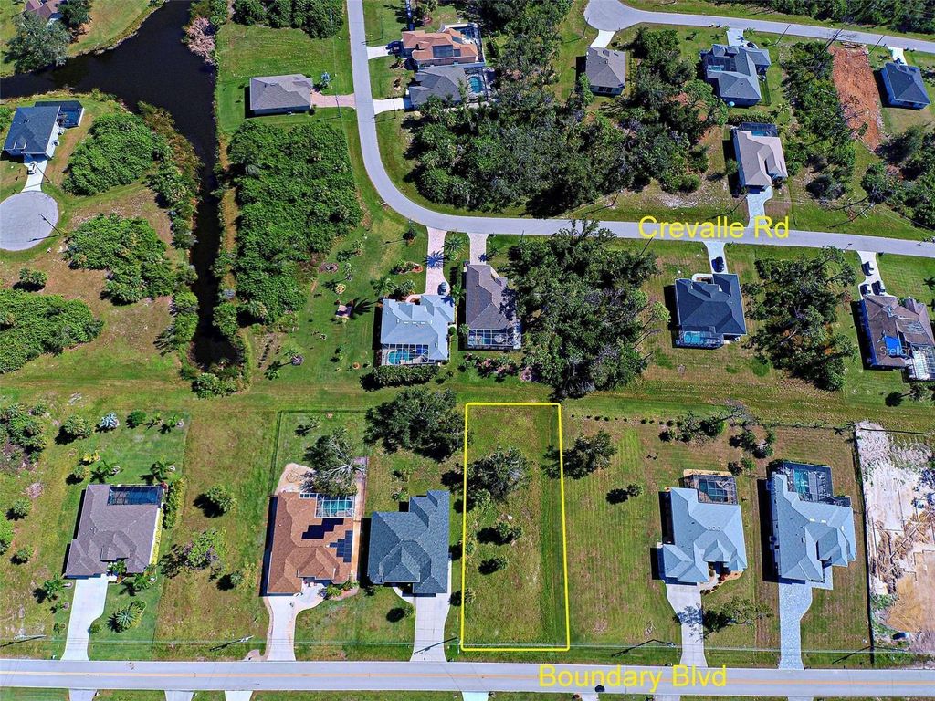 Photo of 859 Boundary Boulevard, Rotonda West, FL 33947 (MLS # N6141444)