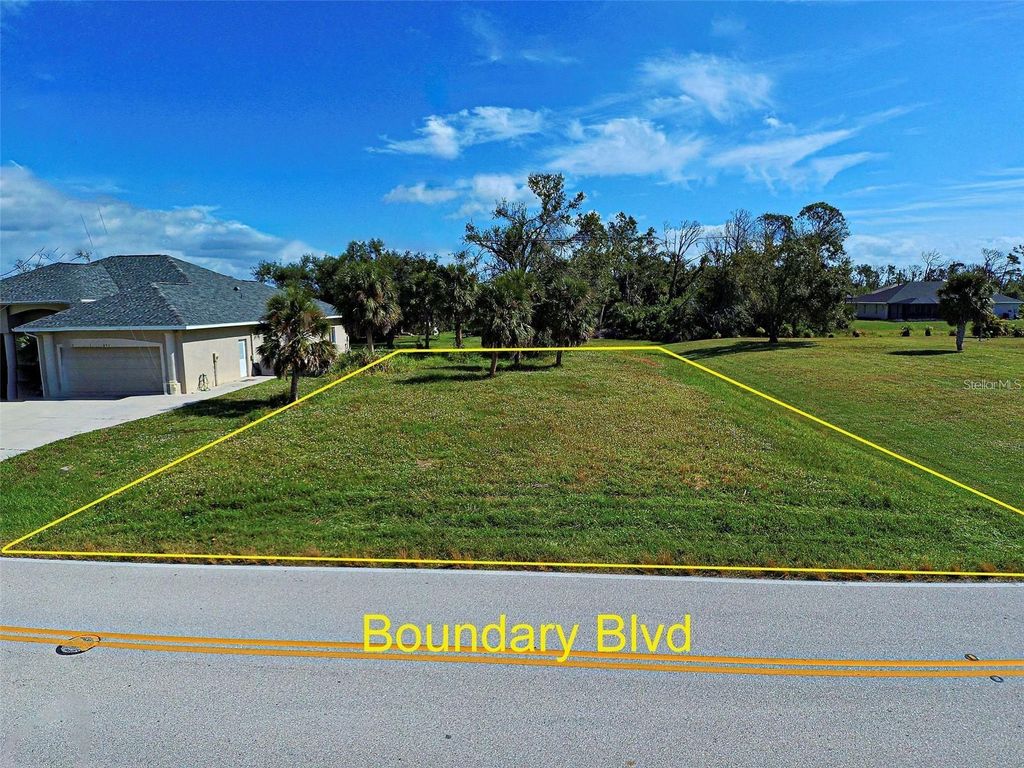 Photo of 859 Boundary Boulevard, Rotonda West, FL 33947 (MLS # N6141444)