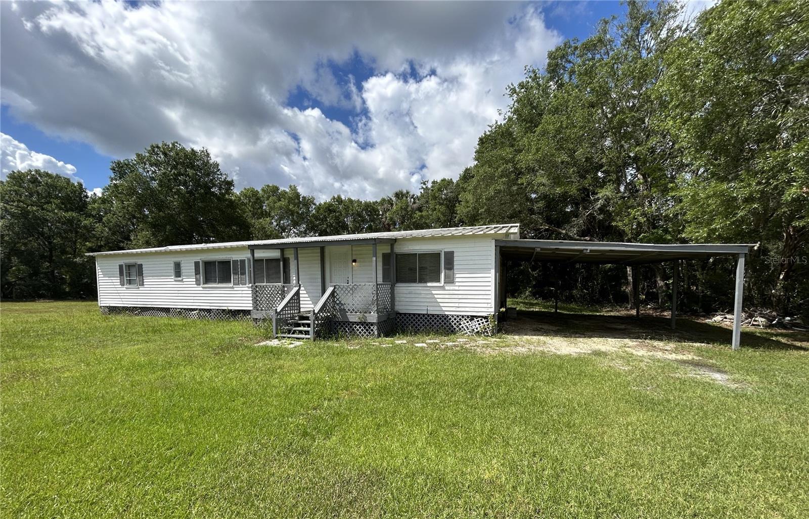 Investor Special or Dream Home Opportunity in Crystal River! Welcome to this spacious 3-bedroom + office, 2-bathroom mobile home boasting 1,464 square feet of comfortable living space on nearly half an acre (.47 acres) in the desirable Holiday Acres subdivision of Crystal River. This property offers the perfect balance of privacy and convenience, located just minutes from vibrant downtown Crystal River, popular restaurants, unique boutiques, and the world-famous Three Sisters Springs—a haven for nature lovers, manatee watchers, and outdoor enthusiasts. Whether you're looking to add to your investment portfolio, create a vacation rental, or settle into a peaceful primary residence, this home offers endless potential. With ample space indoors and out, plus a dedicated office ideal for working from home, this property is primed for personalization or passive income. No HOA means more freedom for your vision—bring your boat, RV, or other toys! Holiday Acres is known for its tranquil setting, larger lots, and proximity to all the best of Crystal River. Don’t miss this chance to own a piece of Florida’s Nature Coast. Schedule your showing today before this opportunity slips away!