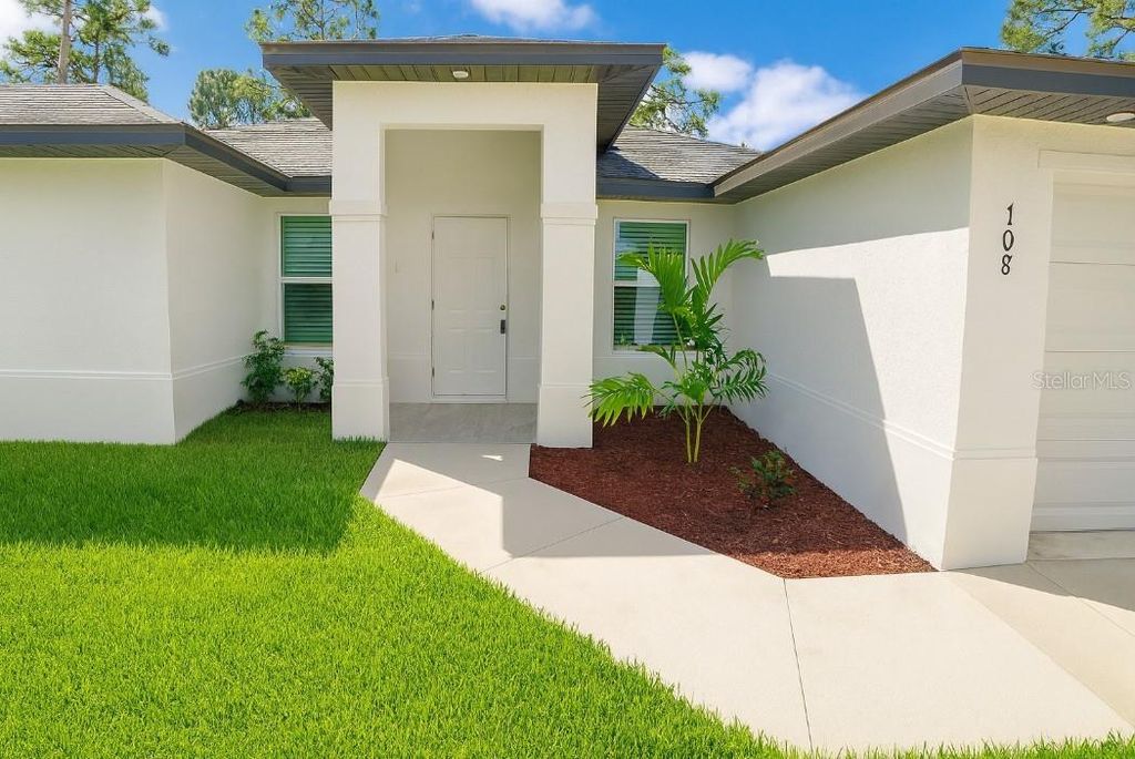 Photo of 708 Lamar Street E, Lehigh Acres, FL 33974 (MLS # O6350748)