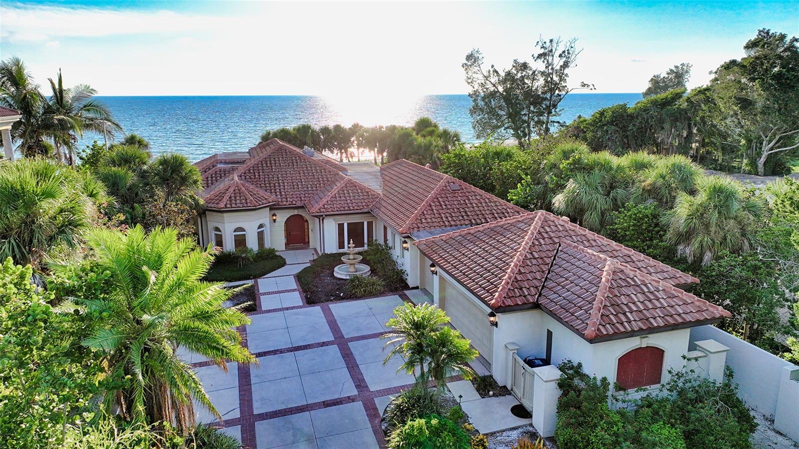 The secluded eight-mile-long barrier island of Casey key is home to some of the finest residents in the country.
Imagine waking up to the warm glow of the sunrise and sound of the waves gently rolling in just a mere few feet from your door on your oversized three quarter of an acre lot with 100 feet of private beachfront access. Watch the world-renowned Gulf of Mexico sunsets from your very own personal pool with unencumbered beach views.
This treasured four-bedroom, three full bath pool home was thoughtfully designed by award-winning architect Cliff Scholz. This property holds the elite status of having one of the highest elevations on all of Casey Key and was built on pilings for the utmost strength and protection. If this sprawling 3528 square foot home is not large enough for your needs the structure provides the strength and ability to build a second story.
Although the location and views of this home are the stars of the show the interior features will not disappoint. Entertain large crowds in your oversized oceanside kitchen/family room featuring sub zero, wolf and Bosch appliances, 150 bottle wine cooler, beverage bar and custom designed cabinetry with marble flooring throughout.
This split floor plan provides for the utmost privacy in your waterfront, oversized, primary bedroom with luxury ensuite bathroom featuring dual sinks, jacuzzi tub and massive walk-in closet.
With a three-car garage and a home nestled far from the road you will have plenty of parking and privacy.
Casey Key is a rare gem with no high-rise buildings and only 266 single family homes. Feel as if you are on your own private island with the vast amenities of Sarasota and Venice only a short drive away.