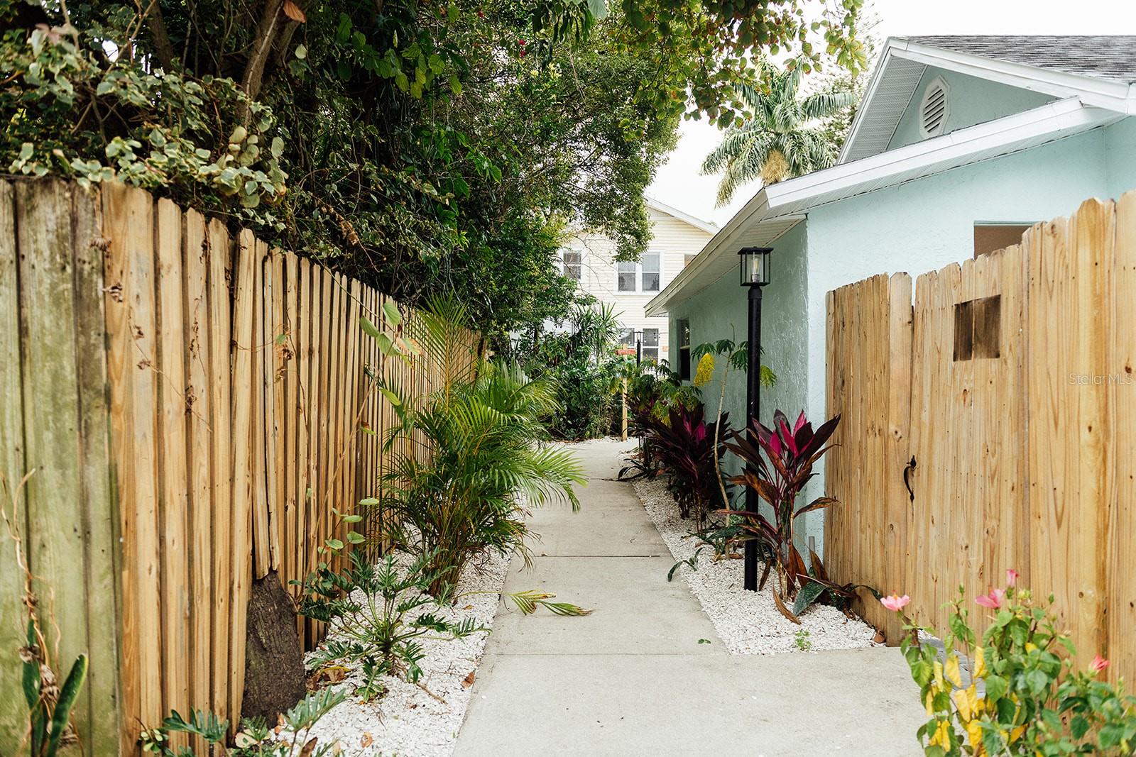 Available for midterm or long-term rental (30+ days) – no short-term rentals. No pets (service animals only). Step into the colorful charm of Blue Heaven, a 1BR/1BA upstairs unit inspired by the iconic Key West restaurant known for its laid-back island flair and tropical vibes. Located in the boutique Mallory Square complex in downtown St. Petersburg, this unit is part of a Key West-themed retreat designed for extended stays with personality and comfort. This fully furnished and fully stocked apartment features vibrant, playful décor, sunny finishes, and thoughtful touches throughout. It includes a dedicated workspace with natural light for a peaceful and productive work-from-home setup. Rent includes all utilities and high-speed internet. Professional commercial laundry service is provided at move-in and move-out to ensure 5-star cleanliness, with app-based shared laundry on-site during your stay (additional charges). Optional cleanings are available upon request.
Location Highlights: Nestled in a walkable, colorful neighborhood just minutes from downtown St. Pete, you’re steps from coffee shops, restaurants, and shopping. Explore Central Avenue, Vinoy Park, museums, and take a short drive to St. Pete Beach. Unwind in Mallory Square’s lush tropical courtyard with turf, palms, and cozy outdoor seating. Move-in Requirements: First month’s rent, cleaning fee, and security deposit. Availability: 7 unique units total – 1BR/1BA and 2BR/1BA layouts available. Contact agent for availability and pricing.