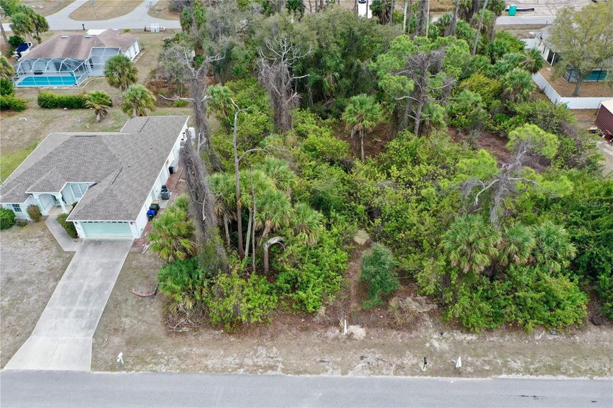 This property on Kenvil Dr is a 10,000 sqft (.23 acre) building lot in North Port, Florida with 81 ft of road frontage and is 125 ft deep! This lot is in an "X" Flood zone, NOT in a flood hazard zone, and is NOT in a Scrub Jay mitigation zone! You will need a Septic tank and well to build on this lot. The property is just off of Toledo Blade, within a few minutes to I-75, or US-41 for easy access throughout the state. Close to many shopping areas, restaurants, and both the Tampa Bay Rays and Atlanta Braves Spring Training Stadiums! Some of the areas best beaches such as Boca Grande and Englewood beach are about 25 minutes away. The Myakka State Forest is not far for those who like to get out in nature! For the golfers, there are several golf courses to choose from all within a 30 minute drive in any direction. Don't miss the opportunity to purchase this property to build your dream home!