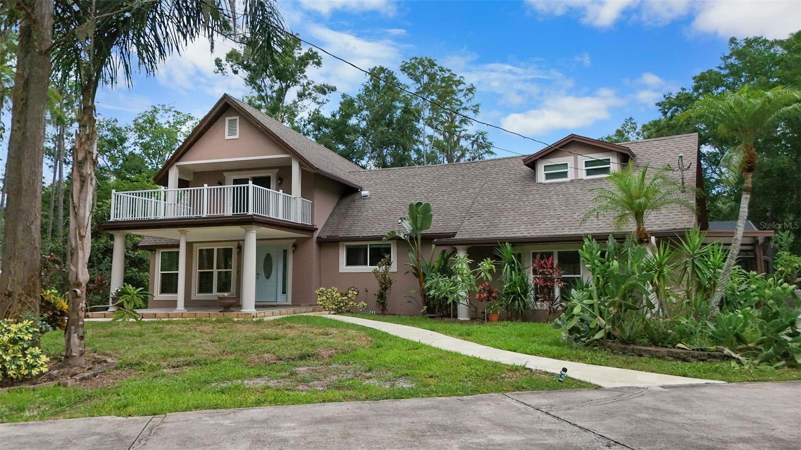 **Welcome to your private retreat at 2202 Amity Court in New Port Richey.** Set at the end of a quiet cul-de-sac and tucked far back from the road behind a gated, keypad-entry driveway, this secluded estate offers unmatched privacy on over 2 acres of beautifully landscaped grounds. This 4-bedroom, 2.5-bathroom home was remodeled in 2016, updated again in 2022, and just professionally painted, making it truly move-in ready. Inside, you'll find 2,743 square feet of thoughtfully designed living space, including formal living and dining rooms with soaring ceilings and a skylight, plus a spacious Great Room perfect for entertaining. The ground-floor master suite opens to a private deck overlooking the backyard, while one of the oversized upstairs bedrooms features a large balcony with views of the peaceful front yard—ideal as a second master. The fourth bedroom offers flexibility as a home office or workout space. Outdoors, enjoy an oversized saltwater pool with screened lanai, a tranquil pond with a nearby fire pit for cozy evenings, and a large shed for outdoor equipment. There’s also ample parking for boats, RVs, or multiple vehicles. This home is perfect for individuals or families who value space, comfort, and above all—**privacy**.