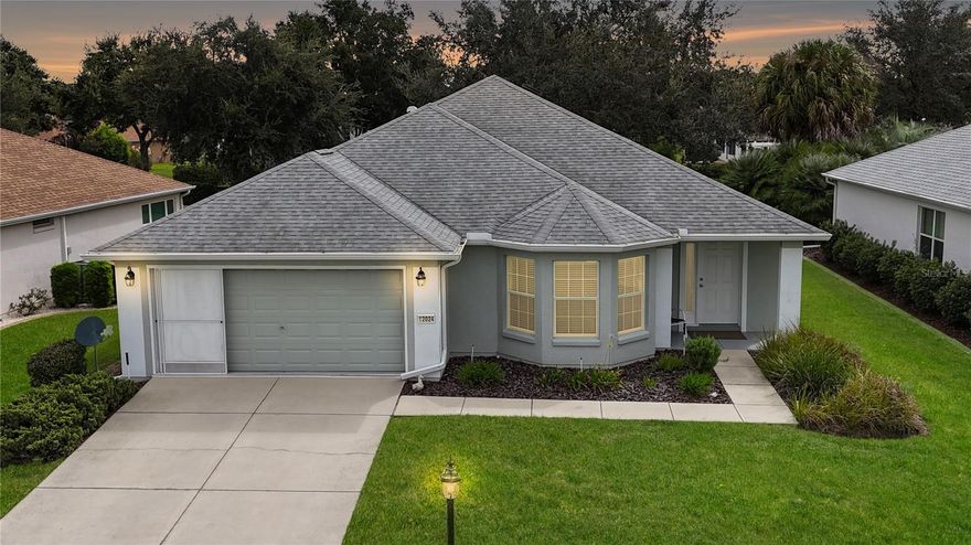 This is a great way to start enjoying the awesome snowbird season in Florida.  This concrete block and stucco, 2/2/2 Challedon model fills the bill.  Not too big and not too small.  Located close to the back gate with access to CR 25.  Great front eat-in kitchen with bay window built specifically to house the breakfast table and enjoy watching the world go by. Large double door pantry, Quartz countertops and large bowl sink.  Upgraded appliances.  Combination living/dining room and is flexible enough to accommodate your needs and wants.  Use it as a dining room or as this homeowner is doing, use it as a reading nook.  Inside laundry complete with washer and dryer and upper storage cabinetry.  Large primary suite (laminate flooring) with en-suite bath (ceramic tile)  featuring double raised vanity, large step-in shower, water closet and walk-in closet.  Guest room also features laminate flooring.  Guest bath has shower/tub combo, raised toilet and raised single sink vanity.  Enclosed climate controlled lanai with great eastern exposure with vertical blinds for privacy.  Two-car garage has privacy screens and keyless entry.  This home has been re-piped in the ceiling and side walls.  HVAC 2018.  Shingles, gutters and downspouts 2021.  Exterior painted 2020. Lots of activities in this community.  One can do as much as you want or nothing at all.  Completely up to you.  Check out our Community Center, Restaurant (Liberty Grill) and the Pro Shop (4 - 9 hole golf courses).  Three heated swimming pools, fitness center, pickleball, tennis, softball, bocce, shuffleboard and so much more.  Walking trails, sidewalks and dog park.  Make this home today.