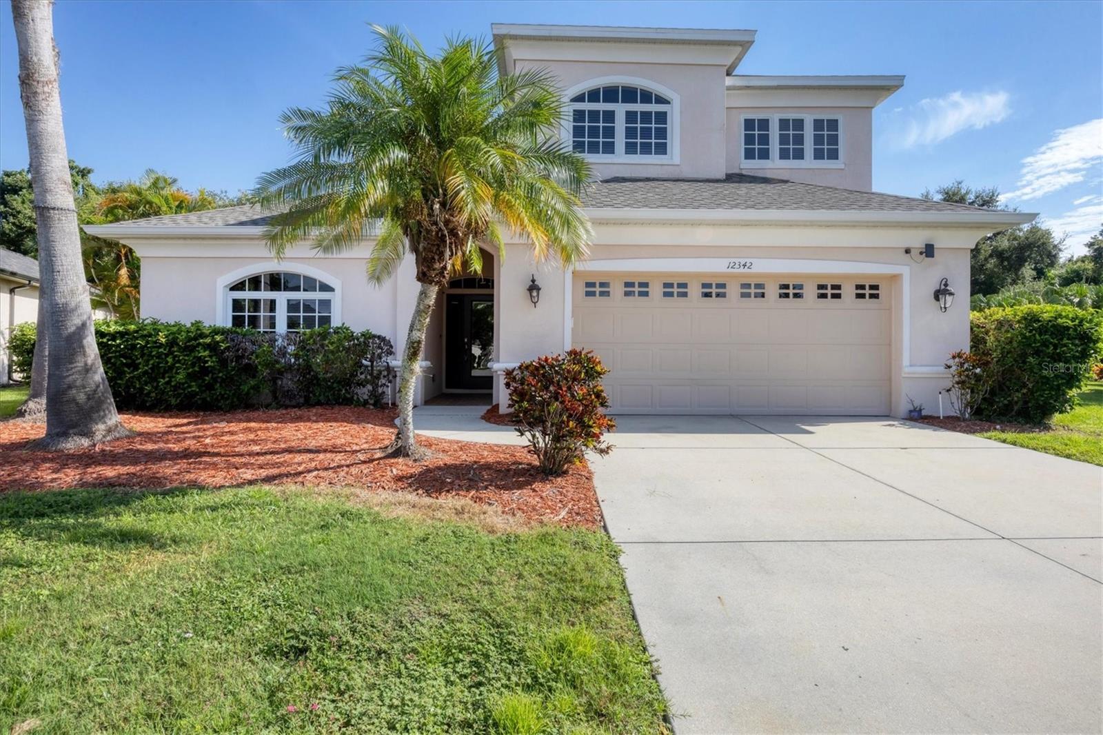 PRICE IMPROVEMENT!! This elegant two-story executive-style pool home offers 2,821 square feet of thoughtfully designed living space, featuring five bedrooms and three full bathrooms. The primary suite and a second bedroom are conveniently located on the first floor, providing flexibility and comfort. Enjoy tranquil views of the private preserve from the spacious living room, which also boasts a cozy fireplace. The open-concept kitchen seamlessly connects to the family room, ideal for both entertaining and everyday living. A large laundry room adds practicality, while the home is nestled within a gated community offering resort-style amenities including a luxurious pool. Abundant wildlife, including frequent sightings of deer, enhances the serene natural setting.