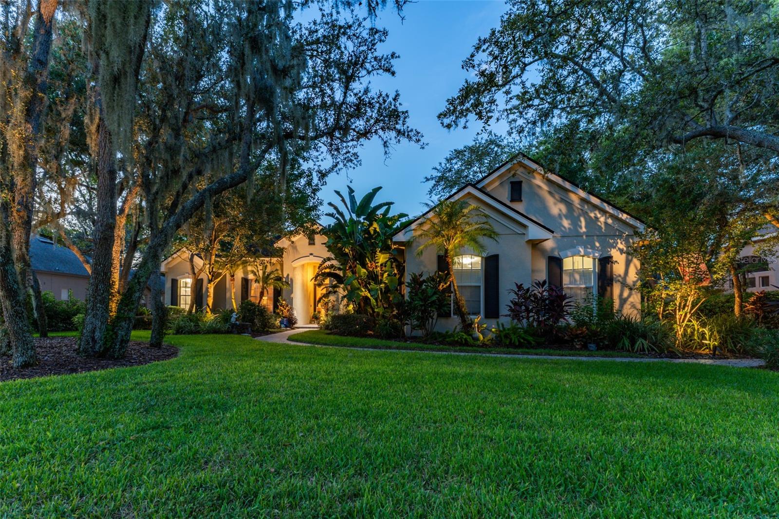 This wonderful Arthur Rutenberg home in the Gated Community of Fish Hawk Trails provides everything you have been looking for & more!! As you approach the home, you will notice the lush landscaping and pavered walkway to the front entrance with a large covered porch that is perfect for enjoying your morning coffee. Enter through double glass doors into an open concept floorplan with an abundance of elegant architectural detail on the ceilings & walls throughout all main living areas. Step onto tile flooring with a decorative inset in the foyer, laid on the diagonal that flows seamlessly throughout the home with carpet in bedrooms & the office. At the front of the home you will find the formal living & dining areas with a spacious office with double glass french doors & a foyered grand entrance flanked with lighting sconces on each side. Continue farther into the heart of the home to the kitchen with abundant wood cabinetry & stone tops, spacious center island, bar seating, gas cooktop, double wall ovens, dishwasher, refrigerator, microwave, glass front cabinets for displaying your treasured pieces above the pass through to the formal dining area, under cabinet lighting & tile backsplash. The family room & eat in area are open to the kitchen featuring a gas fireplae with beautiful windows above & pocket sliders that fully open giving you views and access to the sparkling pool/spa & outdoor living area with an outdoor kitchen featuring a grill, sink & mini fridge. Get ready to spend countless hours in this wonderful haven. The primary suite is privately located on one side of the home with french door access to the outdoor space offering a spacious bedroom with two walk in closets with built in organizers & the light infused EnSuite Bath with walk in shower with decorative tile, dual vanities and soaking tub. There are two bedrooms with a bath in one wing of the home with the 4th bedroom located in a separate area with adjacent bath & large bonus room with a wall of windows that overlook the backyard & sliders to access the outdoor area. One of my favorite features of this home is the landscape lighting in both the front & back, terraced garden areas, brick paved & stone walkways that wind throughout the private & lushly landscaped backyard & backing to the neighborhood trails. This area will be one of your favorites too. Located in the highly sought after gate guarded (24/7) community of Fish Hawk Trails with large executive homesites, miles of trails, wide streets, tennis, basketball & pickleball courts, a community center all surrounded by nature & zoned for great schools. Other important features include A NEW ROOF (2024), newer HVAC's (2024 & 2020), plantation shutters, laundry room with washer & dryer that convey, utility sink, cabinetry & folding table, oversized 3 car garage with built in wood shelving, insulated heavy duty garage doors & more. There is so much to love about this home so make sure to schedule an appointment to see it today!! You don't want this one to get away!!