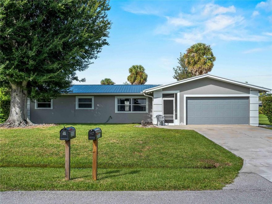 Welcome to 3511 Amanda Street – a beautifully upgraded Punta Gorda home that blends comfort, functionality, and style in a peaceful neighborhood setting. From the moment you step inside, you’ll notice the fresh, modern updates that make this property move-in ready. The open-concept kitchen is outfitted with sleek granite countertops, brand new KitchenAid appliances under extended warranties, and stylish cabinetry, making meal prep and entertaining a breeze. Warm-toned new flooring flows seamlessly throughout, accented by crisp crown molding that adds a touch of elegance to every room. Both bathrooms feature updated tiled showers and new Moen fixtures, giving them a clean, contemporary feel. The home also features recently replaced plumbing, providing peace of mind and long-term reliability. The spacious living area is filled with natural light, and the upgraded 3-ton, 14 SEER AC system (installed in 2025) ensures energy-efficient comfort year-round. Outside, enjoy your morning coffee or evening BBQs in the screened lanai overlooking a large backyard with a 12x12 shed—perfect for extra storage, hobbies, or a workshop. The attached garage has a new door and a tidy laundry setup, while the expanded driveway offers plenty of parking space. Located just minutes from downtown Punta Gorda, this home places you near shopping, dining, healthcare, top-rated schools, and serene waterfront parks. Plus, you're only a short drive away from the exciting new Sunseeker Resort. Don't miss your chance to experience this thoughtfully upgraded home—schedule your private showing today!