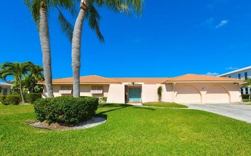 LOCATION LOCATION LOCATION a sought after waterfront residence in Country Club Shores on exclusive  Longboat Key.  Perfect for  
remodel or redevelopment of your custom built island dream hoime. A street with other multi-million dollar properties. Only 3 homes between the intra-coastal waterway and Sarasota Bay affording you views.  There is a a dock with lift for your boat to explore the beatiful waters.   If you are a golfer or tennis player, join the Longboat Key Club just acorss Gulf of Mexico Drive.  With Deeded Beach Access to enjoy the beautiful gulf beaches any time you wish.   It's only a short distance to St Armand's Circle, with great restaurants, bars, shops, art galleries and amenities,  also easy access to downtown Sarasota's Bayfront, arts and theater district and Sarasota Airprt.  Your opportunity to own your very own place in paradise......