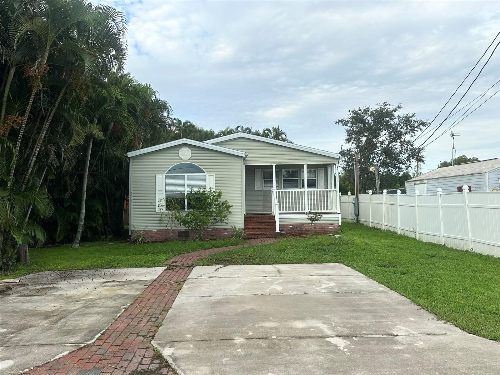 Welcome to this charming cottage style home, perfectly located just minutes from downtown Punta Gorda. No HOA or deed restrictions. Enjoy the convenience of being within a short commute to all the amenities Punta Gorda has to offer. Arriving at the property, you’ll be greeted by a spacious driveway and a welcoming walking path that leads to the quaint front porch—an ideal spot to relax and enjoy your morning coffee. Step inside to find a thoughtfully designed floor plan with luxury vinyl flooring throughout. The home features a cozy family room, a comfortable living room, and a dining area that flows into the kitchen, all with views overlooking the charming front porch. The primary suite offers a generous walk-in closet and an en suite bathroom complete with a walk-in shower and built in storage. This adorable cottage is the perfect blend of comfort and convenience. Don’t miss the opportunity to make it yours, schedule a showing today!