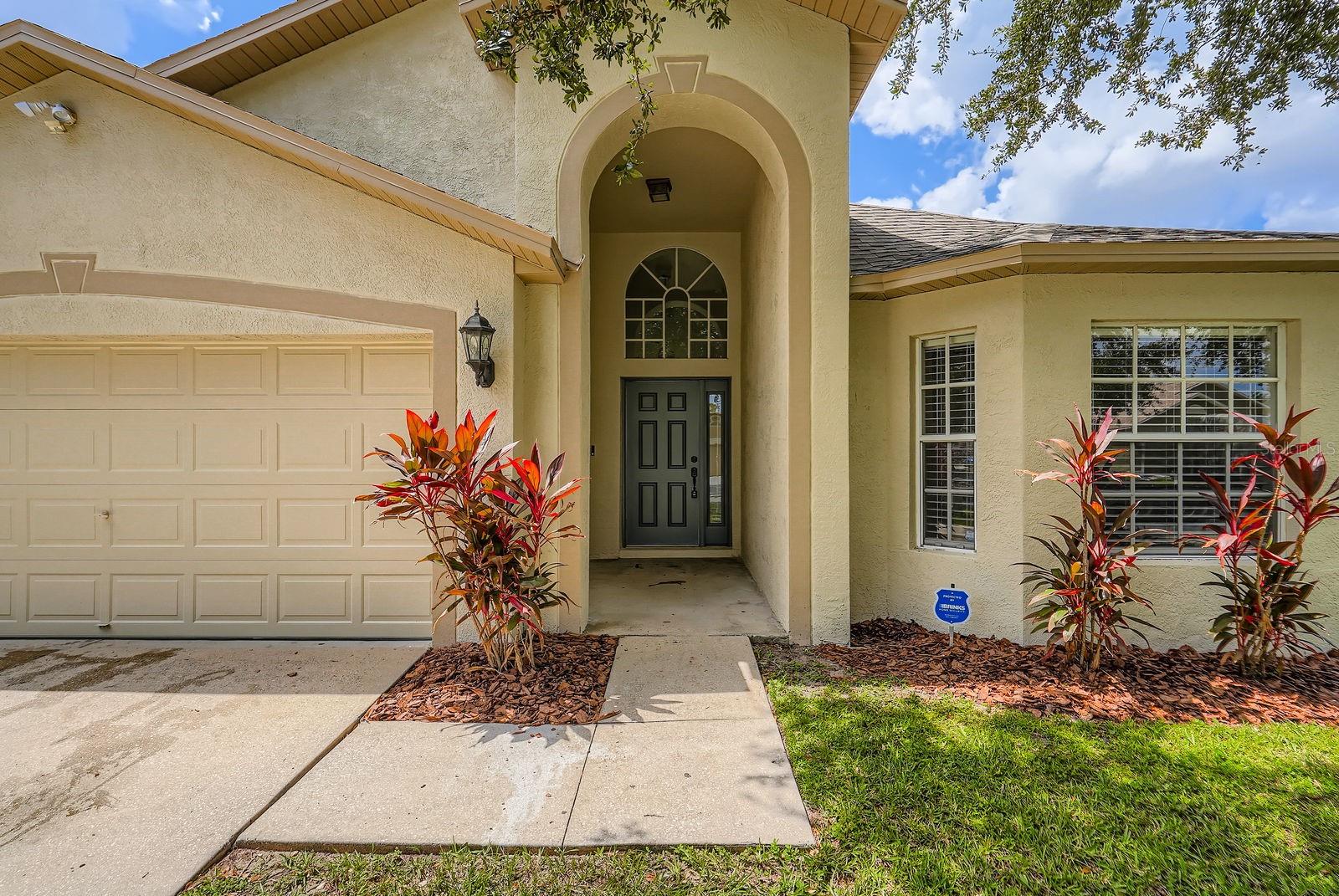 Step into this stunning 4-bedroom, 3-bathroom home, where a grand two-story foyer welcomes you with style and space. Situated on a level lot, this residence is filled with natural light and features an open layout that’s perfect for both daily living and entertaining. The kitchen is a chef’s dream—complete with crisp white cabinetry, stainless steel appliances, and plenty of counter space. Enjoy seamless flow into the spacious living and dining areas, all bathed in sunshine from large windows throughout. The owner’s suite offers a peaceful retreat with dual vanities, a separate soaking tub, and shower. Three additional bedrooms provide flexible bedroom space or an option for a home office. Outside, the fenced backyard is ideal for relaxing or entertaining under the covered patio. A two-car garage adds convenience and storage. This home checks all the boxes—don’t miss your chance to make it yours!