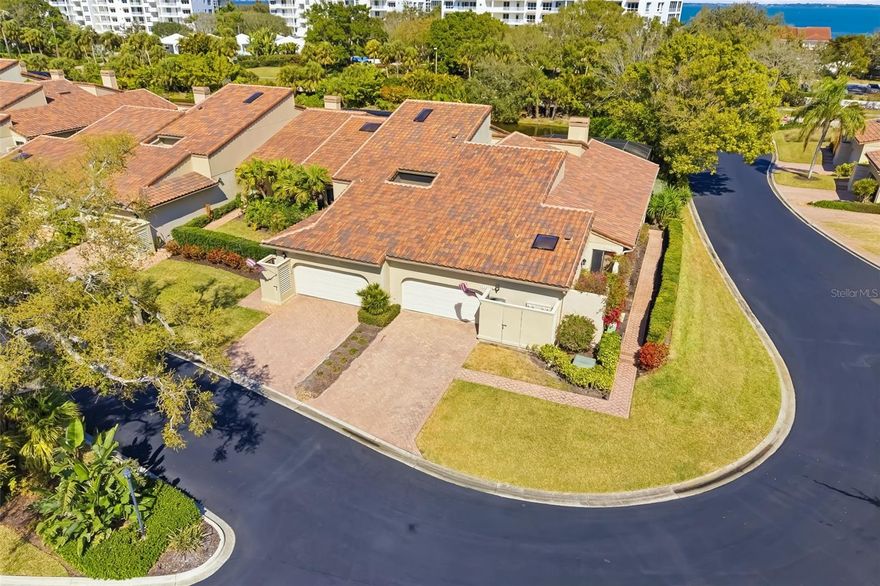 Perfectly positioned and fully furnished this exceptional end-unit villa is located on prestigious Longboat Key within the double-gated Bay Isles community, offering the rare opportunity to embrace true island living with expansive private terrace space and tranquil pond views fed by the saltwater bay. Encompassing nearly 2,400 square feet of thoughtfully designed interiors, this residence delivers privacy, security, and effortless elegance in one of Sarasota’s most coveted coastal enclaves and just moments from world-renowned Gulf beaches.
Inside, soaring vaulted ceilings and inviting natural light pour in, creating an airy and refined atmosphere. The well-appointed floorplan balances sophistication with comfort, featuring multiple gathering spaces including a formal living room anchored by a charming wood-burning fireplace. Expansive sliding doors seamlessly connect the interior to an impressive 740-square-foot private terrace overlooking the serene pond waters, creating a seamless indoor-outdoor lifestyle ideal for sunset entertaining, morning coffee, or elegant evenings under the island sky.
Rich wood flooring, plantation shutters, granite countertops, and updated cabinetry reflect timeless coastal luxury. A skylight enhances the kitchen with beautiful natural light, while recent improvements including a brand-new air conditioning system (2025) and new roof (2025) provide peace of mind.
Two private atriums introduce lush greenery and architectural interest, adding intimate moments within the home. A thoughtfully designed office with a built-in Murphy bed offers flexibility and can easily function as a fourth bedroom, accommodating guests with ease.
The primary suite serves as a spacious sanctuary, while guest bedrooms offer privacy and comfort for family and visitors alike. The private two-car garage features organized storage for beach and recreational essentials, supporting a seamless island lifestyle.
Residents of Harbour Circle enjoy a heated community pool and spa surrounded by manicured tropical landscaping, along with exclusive membership to the gated Bay Isles Beach Club — providing private Gulf-front access with convenient dedicated parking. Living on Longboat Key means enjoying easy access to world-renowned beaches, boating, fine dining, and the amenities of the Longboat Key Club, including golf, tennis, pickleball, marina access, and multiple private dining venues (membership available separately). Everyday conveniences including Publix, banks, the post office, and Longboat Key’s Town Center are just moments away.
Quiet, private, and impeccably maintained, this fully furnished end-unit villa offers the feel of a single-family residence while delivering the sophistication and prestige of island living on Longboat Key.
Schedule your private showing today and experience the elevated coastal lifestyle that awaits.