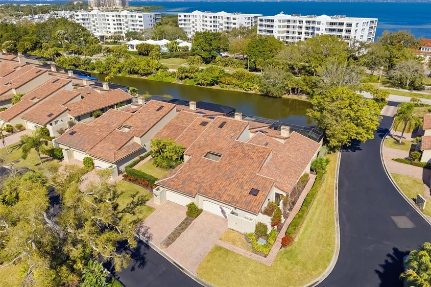 Perfectly positioned end-unit villa is located on prestigious Longboat Key within the gated Bay Isles community, offering the rare opportunity to embrace true island living with expansive private terrace space and tranquil pond views fed by the saltwater bay. Encompassing nearly 2,400 square feet of thoughtfully designed interiors, this residence delivers privacy, security, and effortless elegance in one of Sarasota’s most coveted coastal enclaves and just moments from world-renowned Gulf beaches.
Inside, soaring vaulted ceilings and inviting natural light pour in, creating an airy and refined atmosphere. The well-appointed floorplan balances sophistication with comfort, featuring multiple gathering spaces including a formal living room anchored by a charming wood-burning fireplace. Expansive sliding doors seamlessly connect the interior to an impressive 740-square-foot private terrace overlooking the serene pond waters, creating a seamless indoor-outdoor lifestyle ideal for sunset entertaining, morning coffee, or elegant evenings under the island sky.
Rich wood flooring, plantation shutters, granite countertops, and updated cabinetry reflect timeless coastal luxury. A skylight enhances the kitchen with beautiful natural light, while recent improvements including a brand-new air conditioning system (2025) and new roof (2025) provide peace of mind.
Two private atriums introduce lush greenery and architectural interest, adding intimate moments within the home. A thoughtfully designed office with a built-in Murphy bed offers flexibility and can easily function as a fourth bedroom, accommodating guests with ease.
The primary suite serves as a spacious sanctuary, while guest bedrooms offer privacy and comfort for family and visitors alike. The private two-car garage features organized storage for beach and recreational essentials, supporting a seamless island lifestyle.
Residents of Harbour Circle enjoy a heated community pool and spa surrounded by manicured tropical landscaping, along with exclusive membership to the gated Bay Isles Beach Club — providing private Gulf-front access with convenient dedicated parking. Living on Longboat Key means enjoying easy access to world-renowned beaches, boating, fine dining, and the amenities of the Longboat Key Club, including golf, tennis, pickleball, marina access, and multiple private dining venues (membership available separately). Everyday conveniences including Publix, banks, the post office, and Longboat Key’s Town Center are just moments away.
Quiet, private, and impeccably maintained, this fully furnished end-unit villa offers the feel of a single-family residence while delivering the sophistication and prestige of island living on Longboat Key.
Schedule your private showing today and experience the elevated coastal lifestyle that awaits.