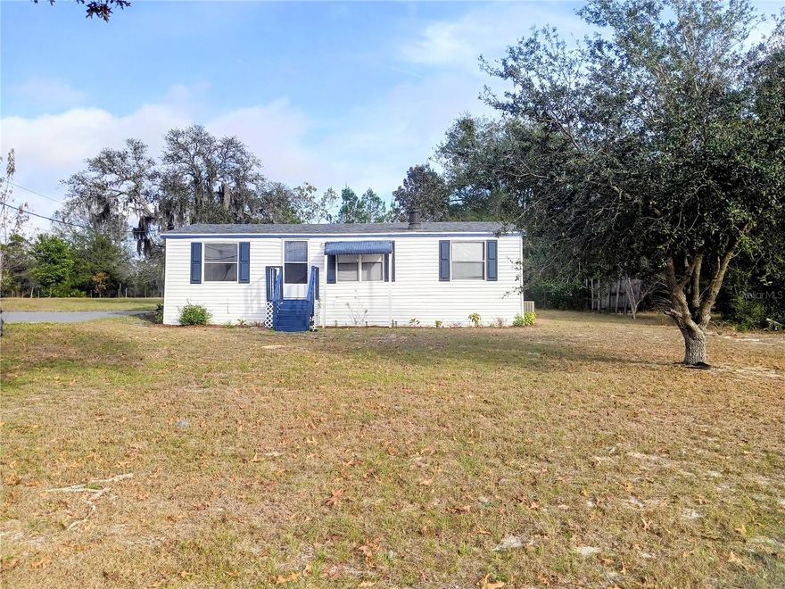 Take a look at this charming, move-in ready, manufactured home sitting on nearly 1 Acre of land!!
Enjoy the peaceful Country Living in this completely remodeled and spacious home featuring 3 comfortable bedrooms and 2 full bathrooms!  This home also features an open floor plan with a Living/Dining room combination which maximizes space and natural lighting. Updated features include Luxury, Non-Slip Vinyl flooring throughout, new cabinets, updated bathrooms, New roof 2023, New plumbing 2023, New Water Heater 2025 and much more! Enjoy the outdoors on your oversized porch while sitting in your rocking chairs, sipping a fresh glass of Sweet Tea. The outside also features a storage large enough for all your lawn equipment. Perfect for those seeking privacy and room to grow, with plenty of space for gardening, entertaining and much more! Conveniently located near local amenities while also offering the tranquility of Rural Living. Don’t miss this opportunity—schedule your showing today!