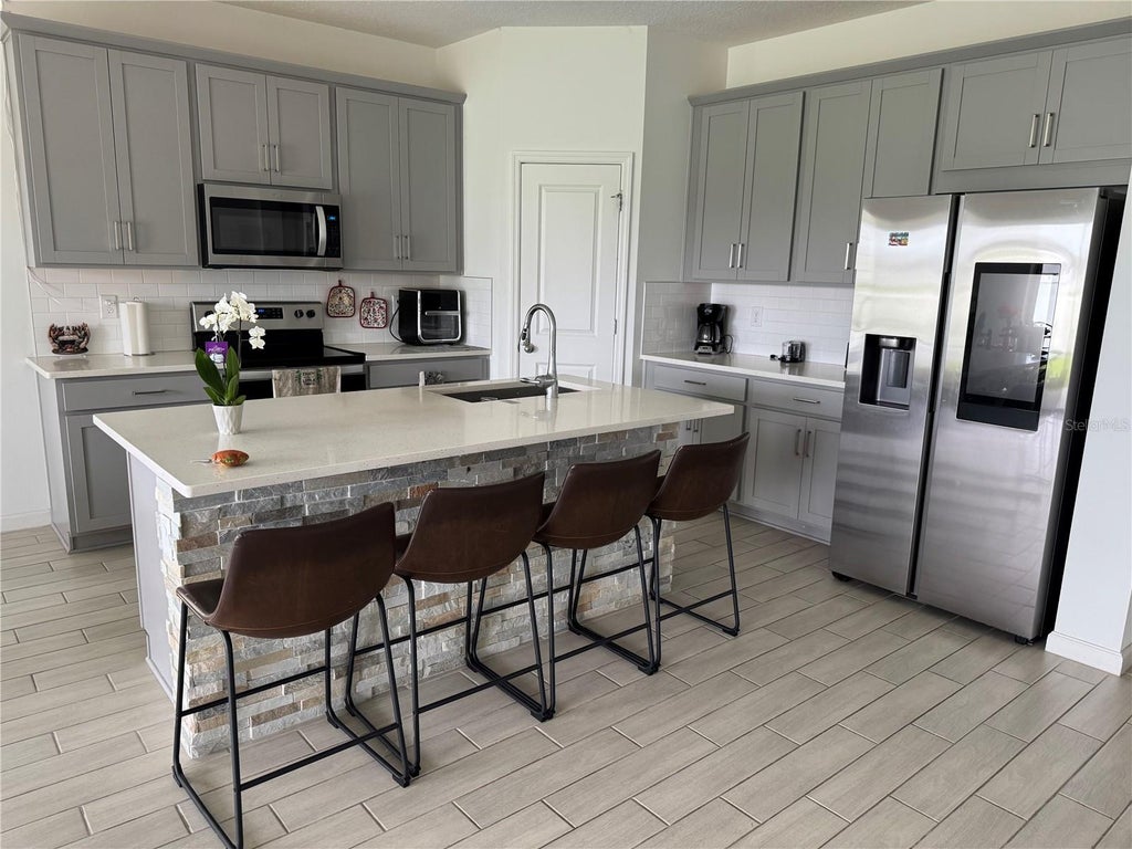 Photo of 1177 Tupelo Trail, Haines City, FL 33844 (MLS # O6416939)