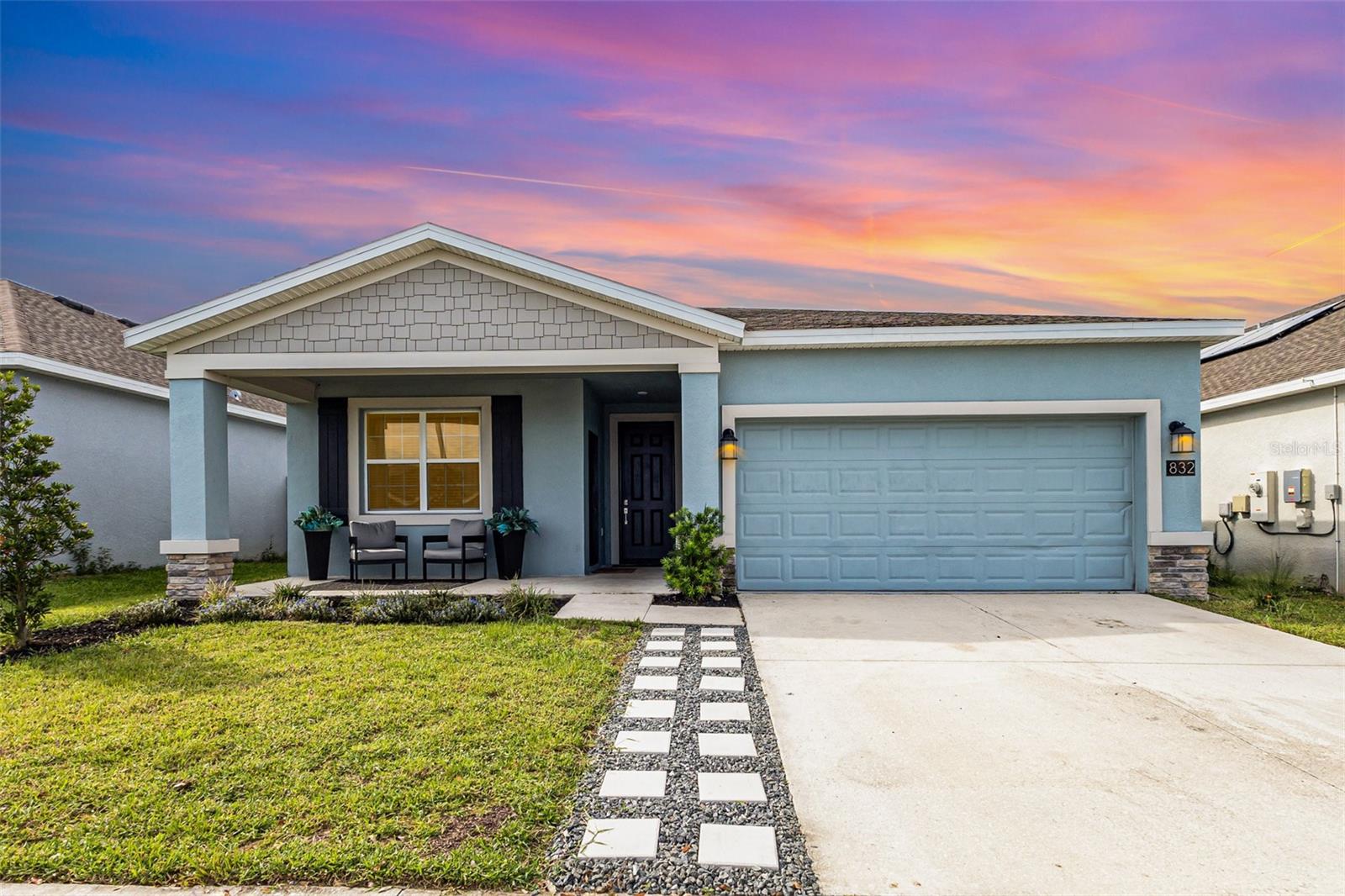 Welcome to your dream home in the sought-after Magnolia Park community of Haines City! This beautifully designed 4-bedroom + private-entry Mother-In-Law Suite + 3-bathroom + Office (or 5th bedroom) home offers the perfect combination of modern style, comfort, and functionality. Step inside to an open-concept layout with high ceilings, abundant natural light, and a seamless flow between living spaces. The chef’s kitchen is designed for both everyday living and entertaining, featuring quartz countertops, stainless steel appliances, and a bar for casual seating. A spacious family room and dining room create the ideal setting for gatherings, holidays, and celebrations with friends and loved ones. The private owner’s suite feels like a retreat with a large walk-in closet and a spa-inspired bathroom showcasing dual vanities, upgraded gold fixtures, a glass shower, and a stylish chandelier fan. The Mother-In-Law Suite is a true standout—featuring its own kitchenette, living room, washer and dryer, bedroom, and full bathroom. With a private entrance and thoughtful design, it’s perfect for multigenerational living, extended guests, or even private rental income. Outdoor living is just as impressive with an extended front porch and a screened lanai/patio, offering plenty of space to relax, dine, or entertain year-round. A hideaway office closet adds extra convenience, while the attached 2-car garage provides additional storage. As part of the Magnolia Park community, you’ll enjoy access to a playground, dog run, and sparkling pool—making this neighborhood ideal for families and pet lovers alike. Located near shopping, dining, and with easy access to Orlando attractions, this home offers the ultimate Florida lifestyle. Whether you’re looking for a primary residence, second home, or investment property, 832 Ofanto Way delivers on style, space, and convenience.