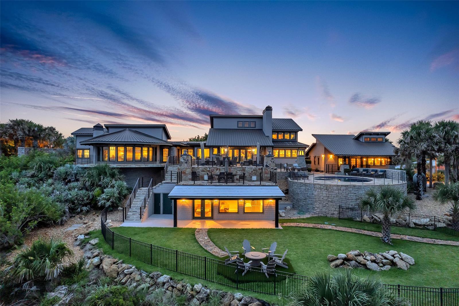 Magnificent and luxurious describes this one-of-a-kind direct ocean front home with guest house. This 6-bedroom 5/2 bath home is located on 1.15 acres, and is one of the largest oceanfront parcels on prominent north beach in New Smyrna Beach. This home has gone through a multi-million-dollar renovation. Surrounded by hand laid stone walls, and flagstone paths and terraces that connect the main home to the guest house and several surrounding garden terraces. The main home has a first-floor master bedroom with expansive panoramic views of the ocean and a spectacular 24 x 10 walk thru closet and located on the south wing of the home for privacy. Beautiful large new eat-in kitchen with custom cabinets, high end granite, spacious island with gas cook top, custom appliances, drink drawers and gorgeous view of the ocean and pool. Large formal dining and living room with expansive ceilings and oak beams open to a massive flagstone outdoor entertaining deck with 1 of 2 outdoor kitchens. Cozy large family room off kitchen with coffered ceilings brings a wonderful coastal feel throughout. 2nd floor consists of 3 bedrooms and 2 full baths. Treat your guest to their own private ocean view space with this one-bedroom guest cottage that has all the luxury of the main home. Large open floor plan with massive oak beams throughout. Granite kitchen, eat-in nook, kitchen island, private deck and Ocean views from living room and kitchen. 3 car garage with temperature control wine cellar Workmanship and materials in this house make this hard to duplicate. The home features are essential to understanding the design and beauty of the property. Don’t miss out on this opportunity to own one of finest Ocean front homes in New Smyrna Beach. ALL MEASUREMENTS AND INFORMATION ARE DEEMED TO BE ACCURATE BUYERS AND BUYERS AGENT TO VERIFY ** ;Water: City