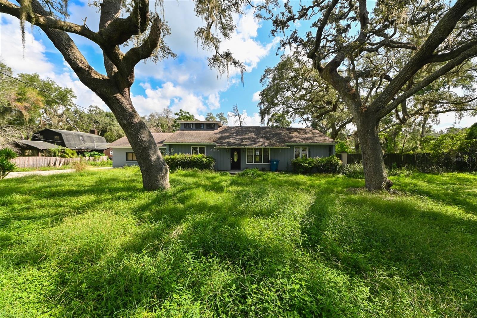 INVESTOR OPPORTUNITY on a Spacious Lot in Dade City! Discover the potential of 34542 Orchid Parkway, a 3-bedroom, 3-bath, 2-story home with 1.803 sq. ft. of living space, set on a generous 0.70-acre lot. This property did experience flood damage, but the ENTIRE SECOND STORY REMAINED UNTOUCHED and the home has already undergone professional mold remediation offering peace of mind and a clean slate for the next owner. The layout provides plenty of flexibility with three bedrooms, three full bathrooms and multiple living spaces to reimagine. The large lot allows room for outdoor living, parking, or future additions, and the quiet Dade City location gives it a blend of privacy while still being convenient to major roadways, shops, and dining. Don't miss your chance to bring this property back to life and create something special! Call now to schedule a private showing!