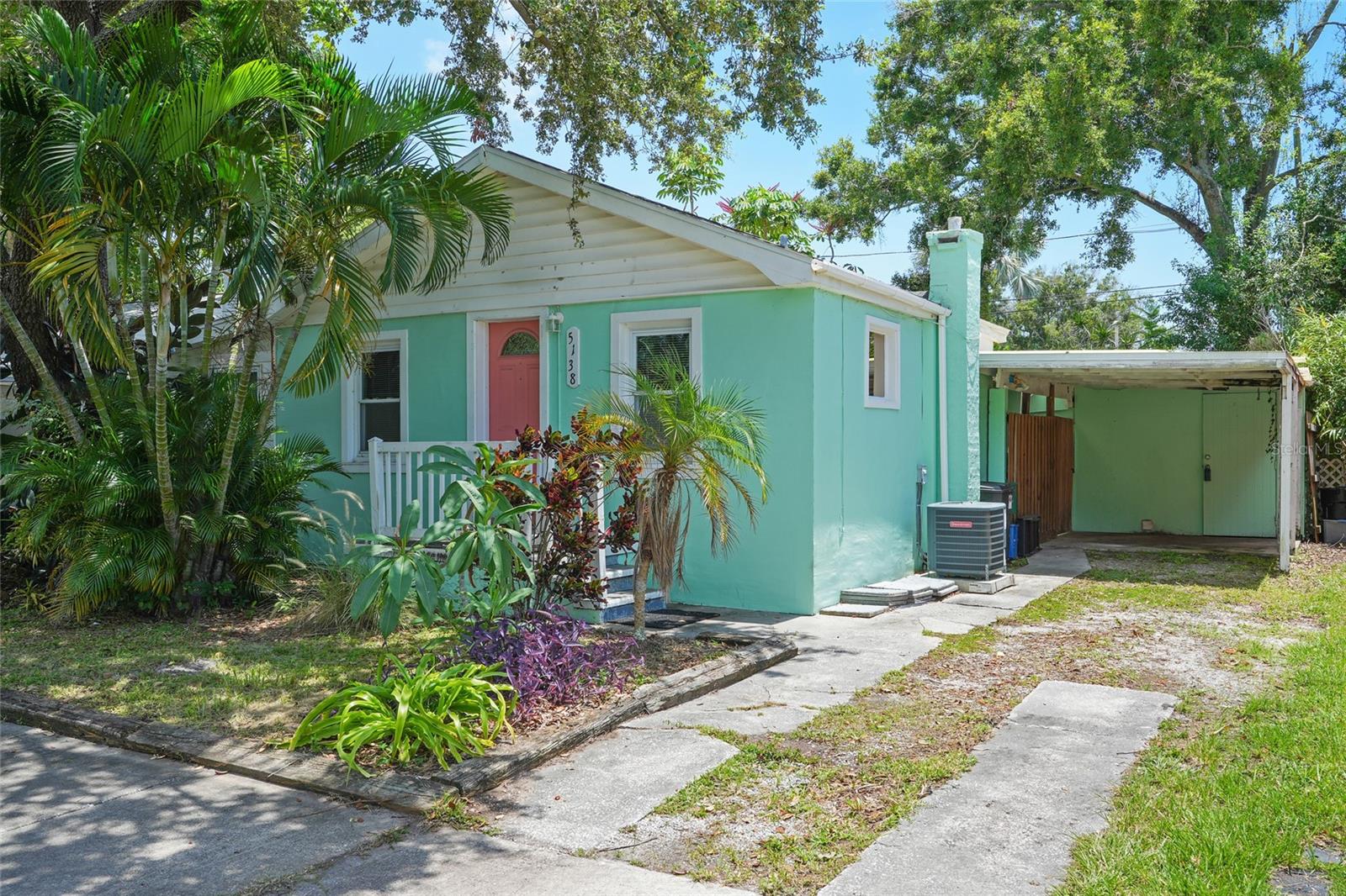 Charming Gulfport Bungalow in Gulfport FL! Welcome to 5138 Preston Ave S, this beautifully maintained 2-bedroom, 1-bath home with a carport is ideally located in the heart of Gulfport’s vibrant arts district. Nestled behind lush tropical landscaping, this inviting residence features a warm living area with a striking wood accent wall, seamlessly flowing into the dining space and a functional galley-style kitchen. The home offers two spacious bedrooms and a full bath, all thoughtfully laid out for comfort and privacy. Step outside to your backyard oasis—complete with a covered porch, pavered lounge area, and fully fenced yard with space for a pool. Just minutes from downtown Gulfport’s shops, restaurants, galleries, and markets, and a short drive to St. Pete, the beaches, and major thoroughfares. Don't miss your chance to own a slice of Gulfport charm!