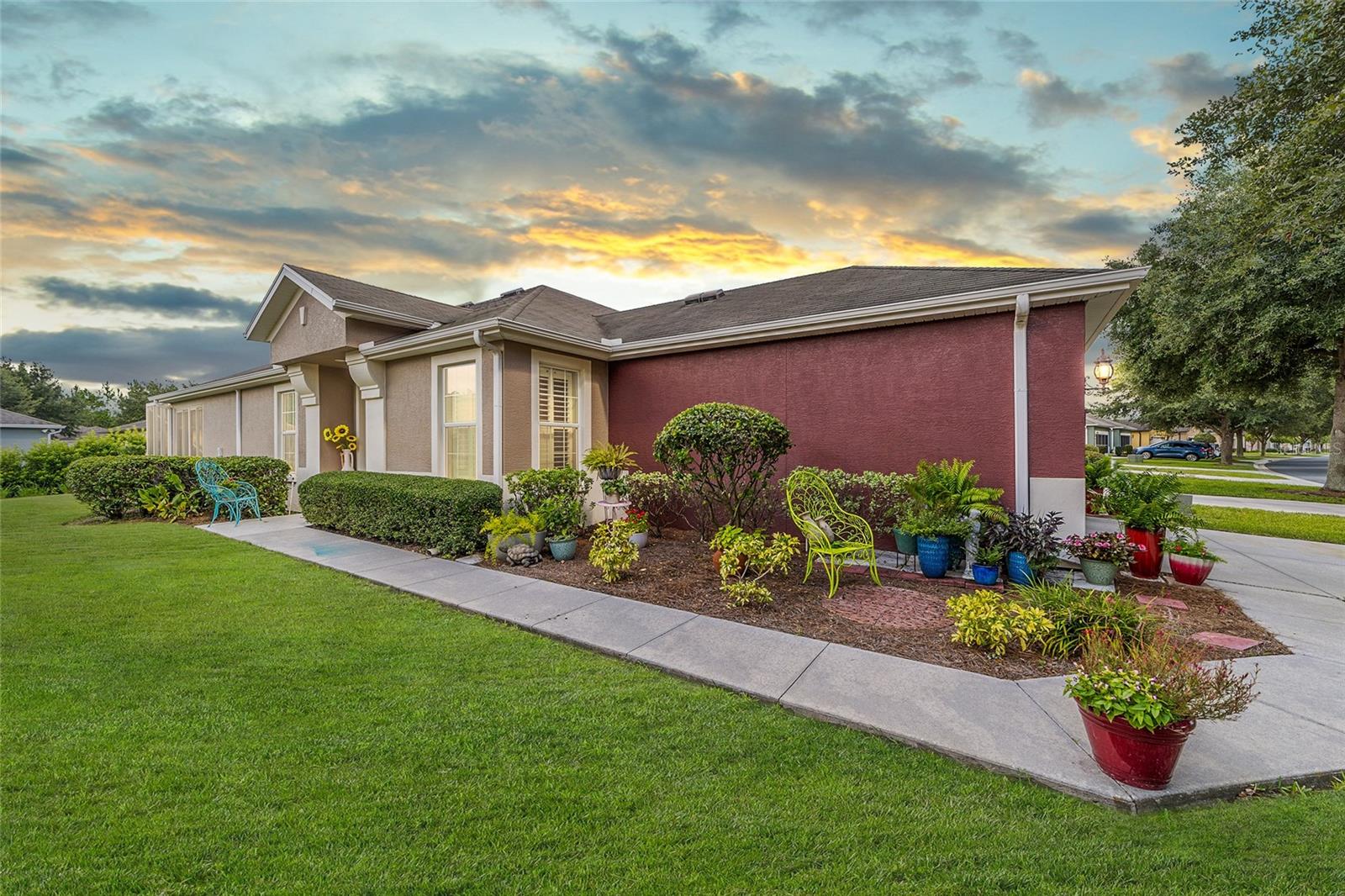 Live life on vacation! Welcome home to resort-style living, every single day, with this stunning, maintenance-free Augustus model villa. Complete with a versatile flex room, this home offers something for everyone in the 55+ gated golf community of Stone Creek, featuring year-round resort-style amenities. Nestled in the Pinebrook neighborhood, this thoughtfully designed home blends warmth, style, and function in one impeccable package. Step through a welcoming foyer into an inviting open floor plan enhanced by updated flooring, plantation shutters, and a soothing designer color palette. Ideal for entertaining or unwinding, the spacious living and dining areas flow seamlessly into a beautifully refreshed kitchen featuring Shaker-style cabinets with crown molding, neutral Corian countertops, stainless steel appliances, a striking tiled backsplash, LED downlighting, and bar-height seating for casual meals or conversation. Twin glass sliders in the gathering room open to a covered lanai and oversized birdcage patio—your go-to retreat for morning coffee or relaxed evenings under the stars. The owner’s suite is equally impressive, with a generous walk-in closet and a spa-inspired en suite bath showcasing a recently updated sleek walk-in shower with statement tile, plus a granite-topped double vanity. Glass inset French doors frame the bonus flex room offering ideal space for a den, studio, or home office, while the welcoming guest room ensures comfort for overnight visitors. As part of your HOA, enjoy peace of mind with included landscaping, exterior painting, roof care, and irrigation. Your new lifestyle awaits—backed by numerous community activities and endless amenities that cater to an active and vibrant lifestyle and include a golf course, resort-style pools, sports courts, a health spa, trips and entertainment, and more! This villa is more than a home—it’s a gateway to the life you deserve.