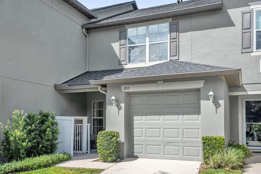 Welcome to the highly sought-after gated community of Heritage Park Townhomes in Winter Springs! This tastefully remodeled 2-bedroom, 2.5-bathroom townhome is completely move-in ready and filled with stylish custom upgrades throughout. Step inside to find a warm and inviting living space featuring a custom-built wooden mantle over the electric fireplace, creating the perfect focal point for relaxing or entertaining. The dining area showcases a stunning custom 3D accent wall adding a modern designer touch to the home. The kitchen is beautifully upgraded with quartz countertops, stainless steel appliances, and a pantry providing additional storage space. Upstairs you’ll find both bedrooms thoughtfully laid out in a split floor plan for added privacy. The spacious primary suite features a walk-in closet and an ensuite bathroom complete with quartz countertops and a stand-alone shower. The laundry area is located upstairs in its own designated hallway closet for easy access. When you step outside to your back patio, you'll notice the owners added pavers creating the perfect cozy outdoor space for relaxing evenings or late-night movies under the stars. Enjoy low-maintenance living with an HOA fee of only $300/month which includes exterior grounds maintenance, gated community access, community pool, and a playground. This unit also offers a 1-car garage, private driveway parking, and additional guest parking spaces designated for visitors. Located near shopping, dining, parks, and major roadways, this beautifully updated townhome is ready for its next owner to call home!