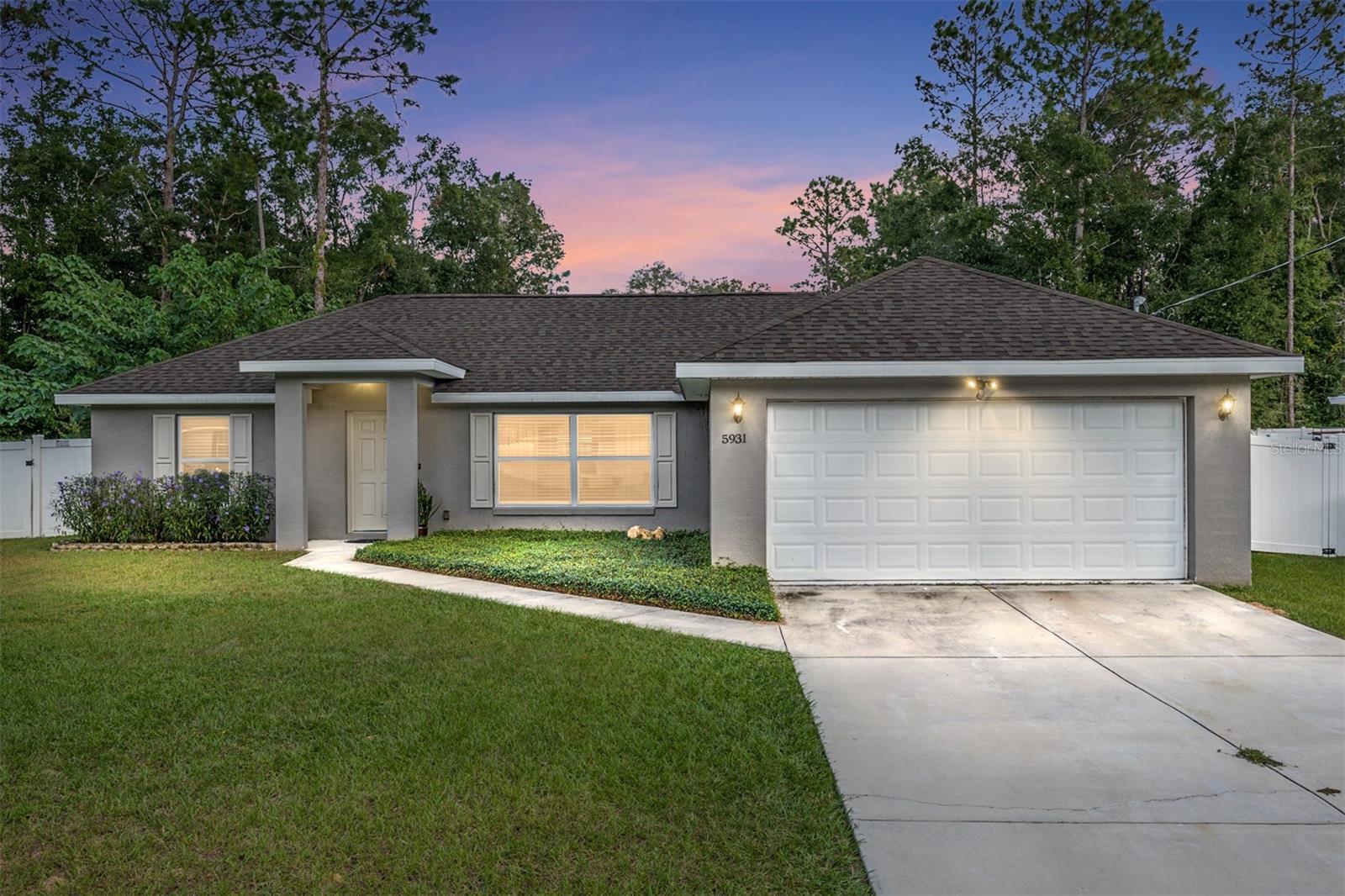 This inviting 3-bedroom, 2-bath block home, built in 2020, is move-in ready and filled with thoughtful upgrades. Located in the desirable Ocala Park Estates, this home features an open floor plan with a split layout and a spacious family room, perfect for gatherings.
The kitchen is a chef’s dream, highlighted by a large island with quartz countertops, a deep sink, and an upgraded faucet. The primary bedroom offers a large walk-in closet and an ensuite bathroom with a walk-in shower and generous countertop space. Glass sliders from the kitchen open to a fully fenced backyard, complete with a concrete patio for outdoor enjoyment. A charming swing set and a custom-built chicken coop add unique touches, and the neighborhood allows for backyard chickens.
For added convenience, the two-car garage includes a mini-split AC unit, ensuring a comfortable workspace even on warmer days. This home is easy to show and ready for its new owner—without the hassle of HOA fees. Conveniently located near the World Equestrian Center (WEC) and shopping, this home offers both comfort and convenience. Don’t miss out!