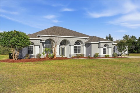 Photo of 4873 NE 64 Avenue, Silver Springs, FL 34488 (MLS # OM731122)
