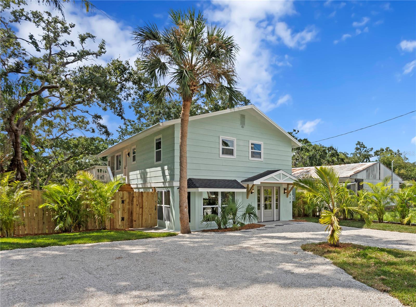 This spectacular fully remodeled 3 bedroom, 2.5 bathroom Florida style home has approximately 60 feet of saltwater canal frontage with direct access to Mobbly Bay and Tampa Bay! Enjoy water views from most rooms in this home, which has a great floor plan for entertaining. Enter into the first floor family room with a natural wood entry accent wall, dry bar and bay windows. The walk out primary bedroom to the backyard and has a walk-in closet and a sleek and modern en-suite bathroom with double vanity, a large shower with multiple shower heads and beautiful floor tile which channels the ocean. A spacious laundry room, half bathroom and several storage closets are also found on the first floor. Upstairs the stunning kitchen has dual-toned cabinets, granite counters with a waterfall edge, a breakfast bar and dining area. Sliding doors open to a second floor screened- in porch and offer sweeping views of the canal from the kitchen and living room. Two additional bedrooms upstairs are spacious and share a renovated full bathroom with shower and tub. The fenced backyard has plenty of yard space as well as a paver patio, crushed shell patio with fire pit, a new wood dock and a storage shed. Remediation and renovations have been fully permitted and include new windows and hot water heater. This home also sits on a quiet street in a scenic neighborhood of waterfront properties and beautiful horse farms, and within easy proximity to both Tampa and Saint Petersburg, Tampa International Airport, restaurants, shopping and more.