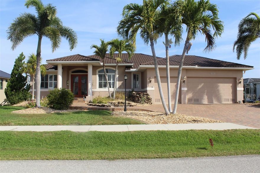 Welcome to 1600 Suzi Street in Beautiful Punta Gorda Isles. CUSTOM SALT WATER POOL HOME W/GOLF COURSE VIEWS! Begin your life in paradise w/this custom-built, 3 bed/2 1/2 bath , plus office home in PGI overlooking the 4th fairway of St Andrew's South golf course. Step inside from the paver walkway into a spacious, great room & disappearing sliding glass doors that lead to the lanai. The large master suite has walk-out access to the lanai, two walk-in closets & a spa-like master bath w/dual sinks, private WC, linen closet, garden tub & glass-enclosed shower. The split bedroom floor plan offers large guest rooms that share a guest bath There have been many new upgrades starting with a new metal roof in 2024, and HVAC replacement. Also the pool has been resurfaced in 2018 for decades of pool enjoyment. Storm Smart electric rolldown shutters for entire Lanai, along with electric shades for Great room sliding doors. Also sit out front and enjoy your own waterfall and Koi pond with mature landscaping